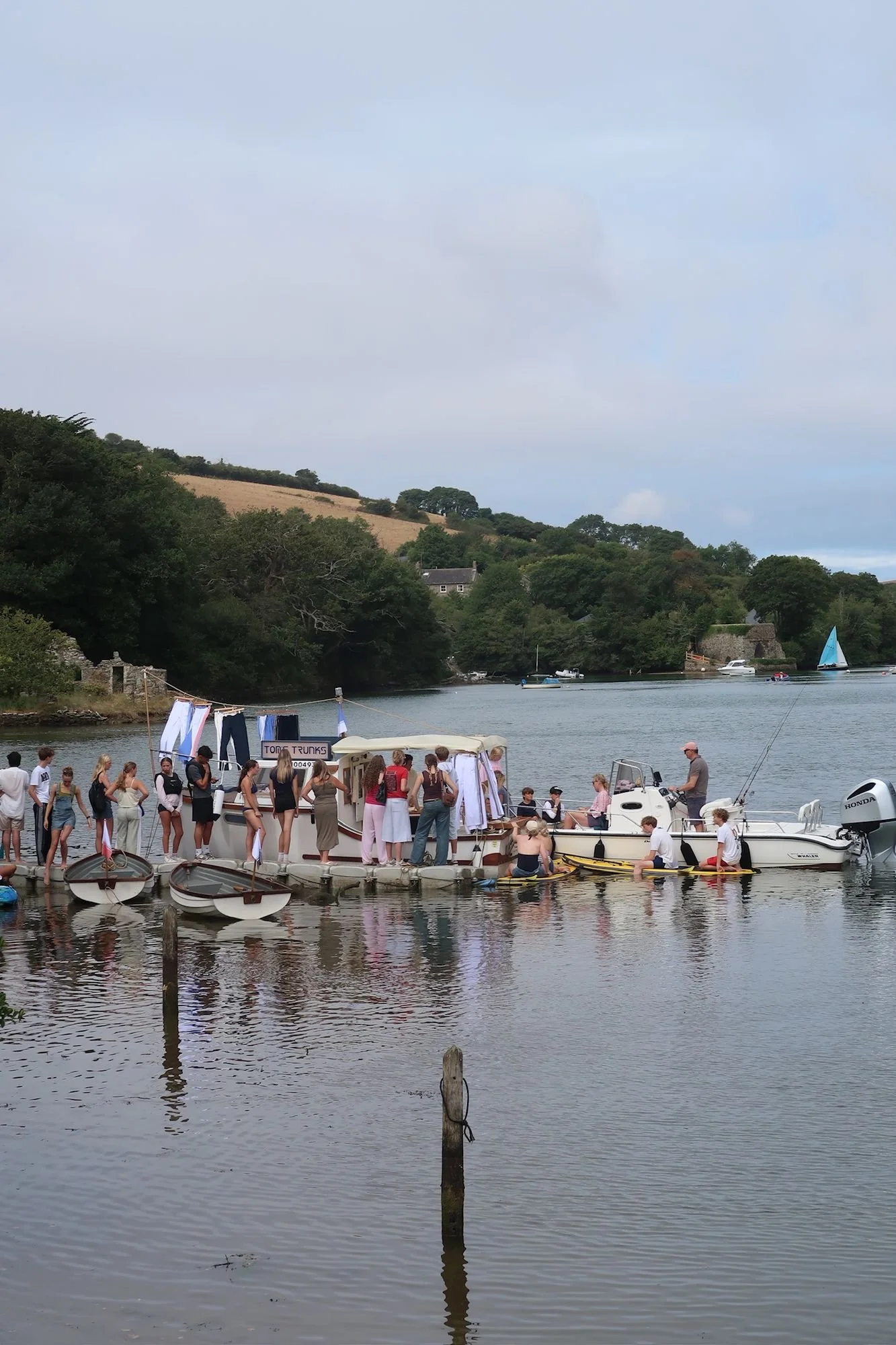 db-studios-toms-trunks-guests-boarding-pontoon.jpg