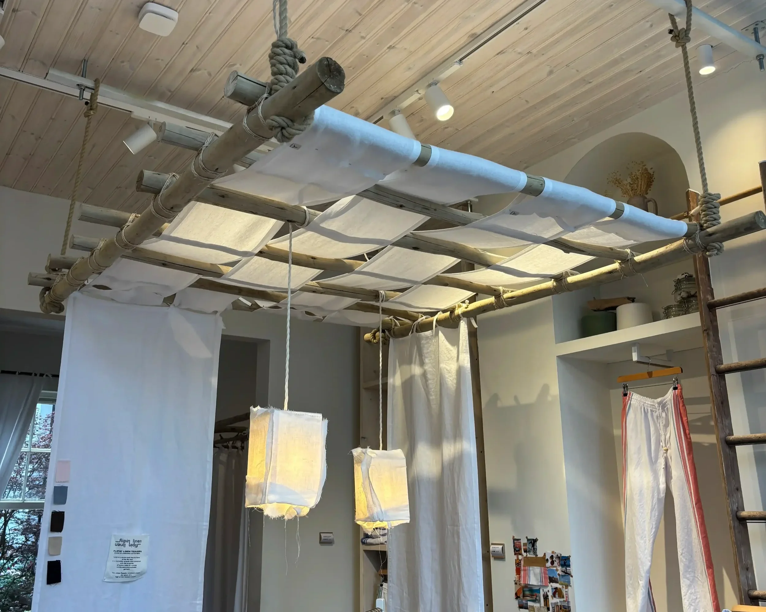 Tom's Trunks bespoke retail interior bamboo lattice ceiling installation with rope suspension and fabric pendant lampshades