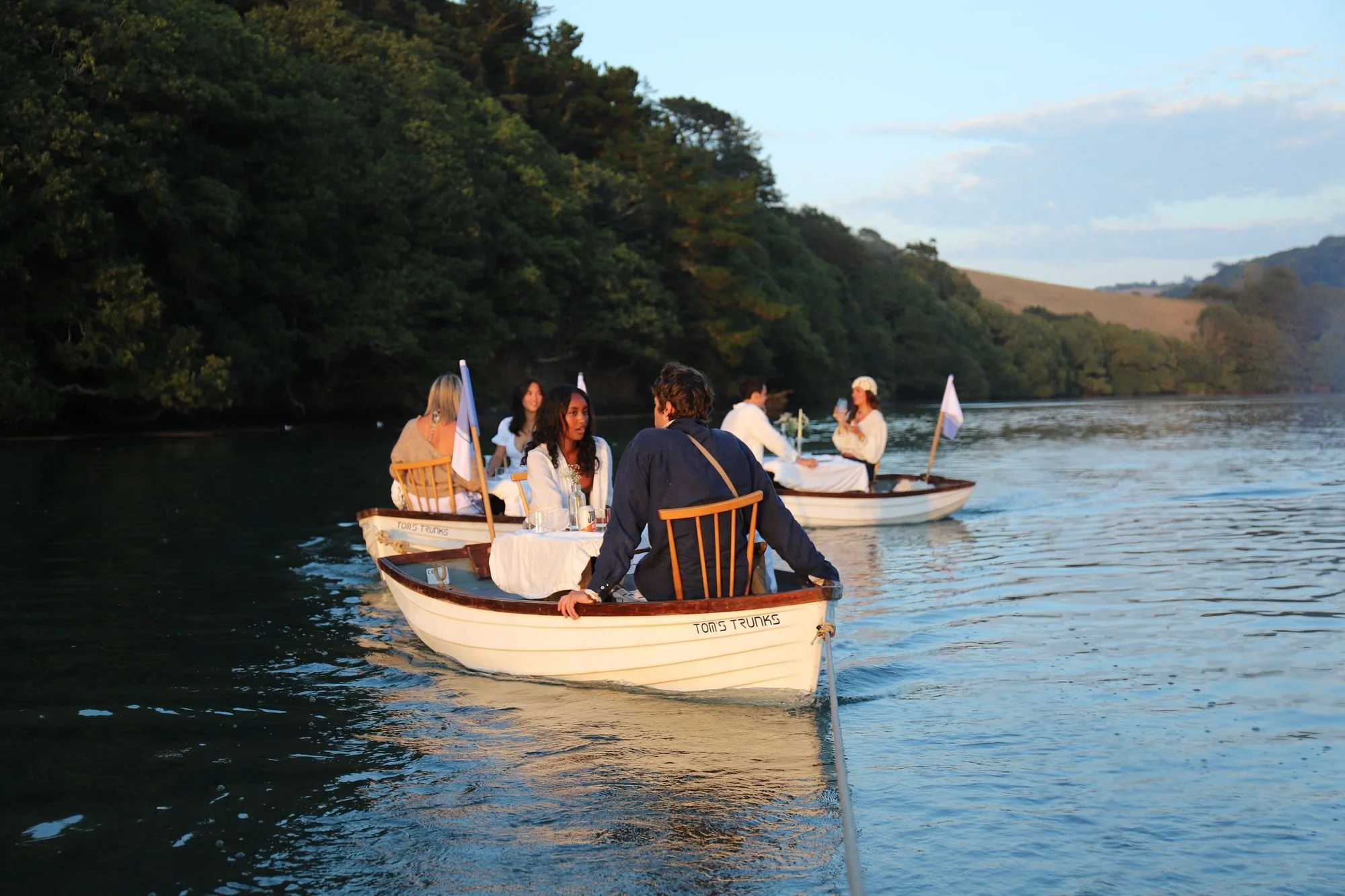 db-studios-toms-trunks-dining-boat-guests-dinner.jpg