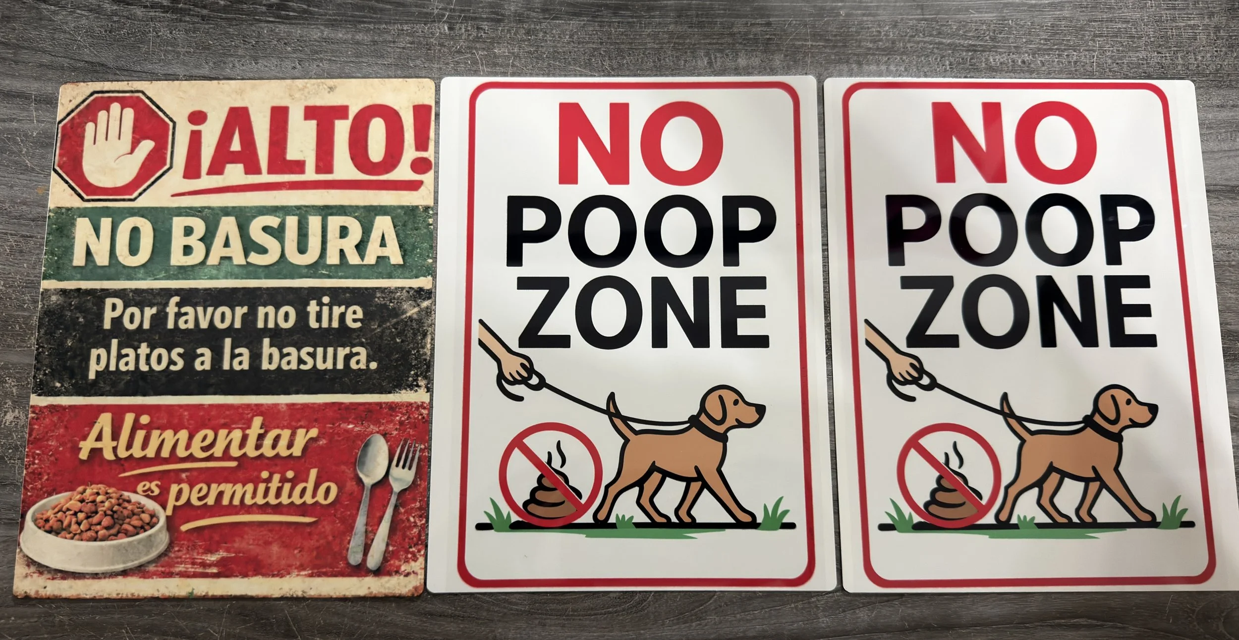 Three signs with warnings about littering and pet waste. The first sign is in Spanish, saying "Stop! No trash. Please do not throw plates in the trash." The second and third signs are in English, stating "No poop zone" with a graphic of a dog on a le