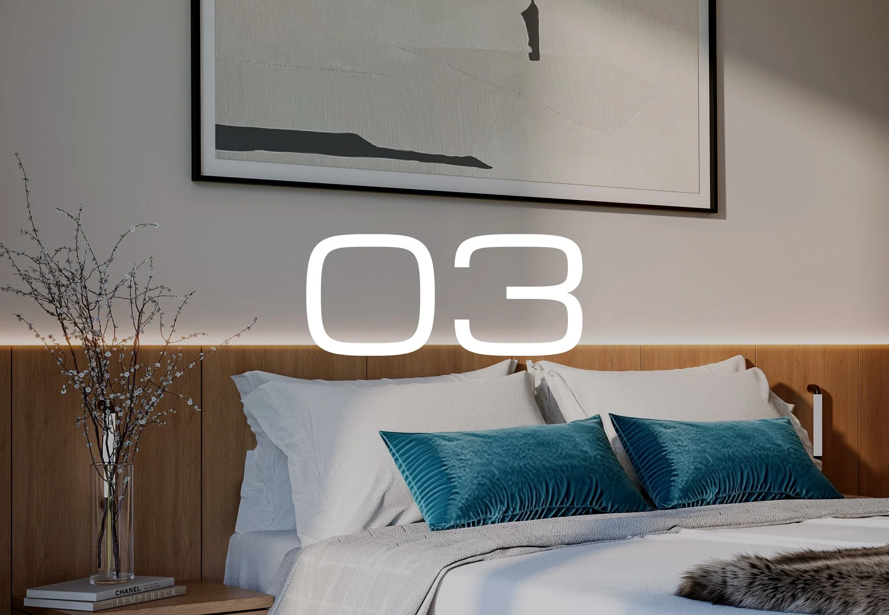 Apartment 03. A modern bedroom with a wooden headboard, white bedding, two blue pillows, a bedside table with books and a vase of blossoming branches, and a large framed artwork hanging above the bed. The number 03 is overlaid in large white text.