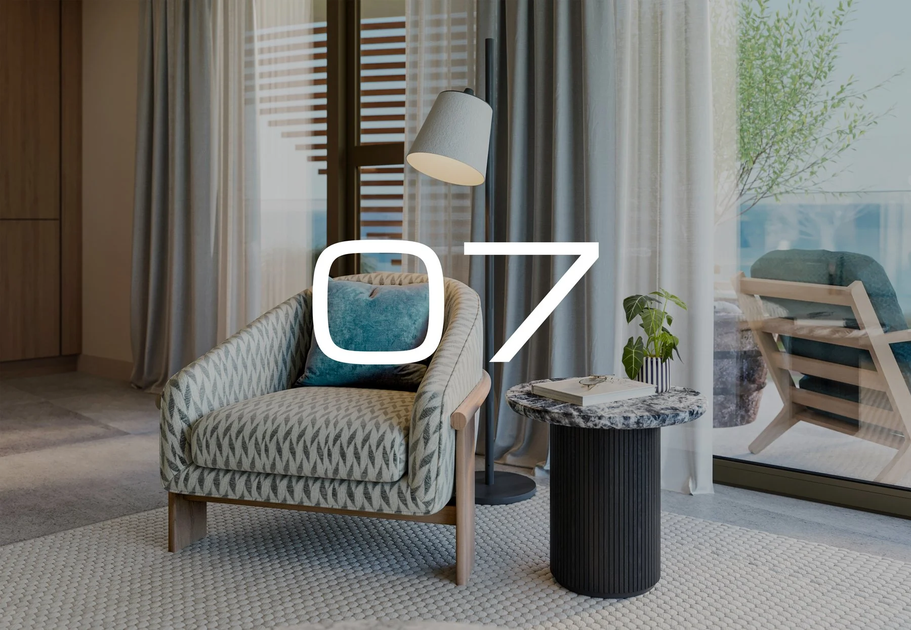 Apartment 07. A cozy living room with a patterned armchair, a small round marble side table with a plant and books, a floor lamp, and large windows with curtains showing a patio with outdoor seating and greenery.