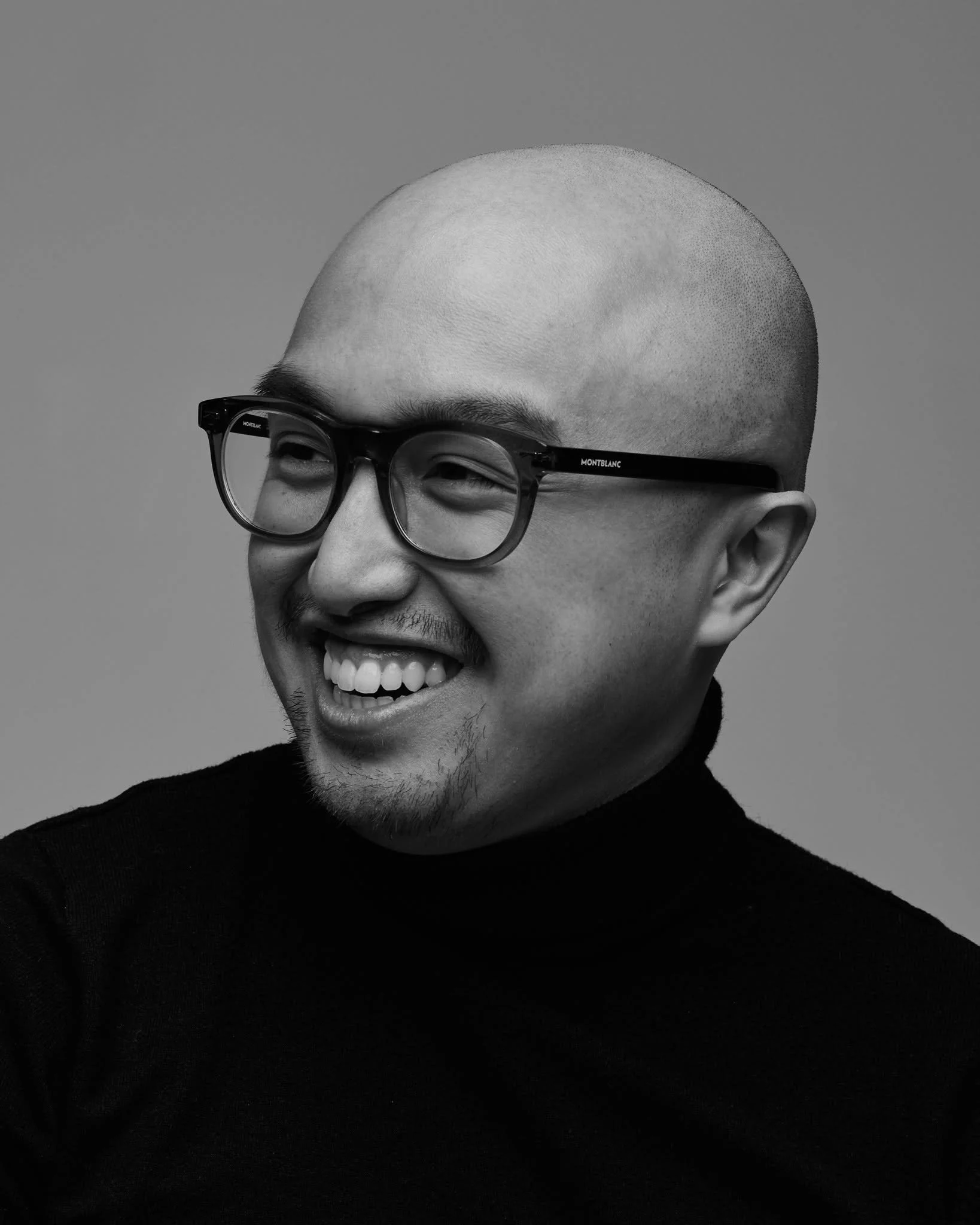Black and white portrait of Philippe Manh, fashion photographer and lighting director based in Montreal