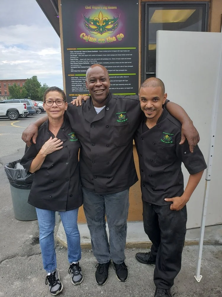 Chef Wayne G. Hooker with Lisa Wyatt-Hooker and Chef Ivan Felix outside Cajun on the Go, Springfield Massachusetts