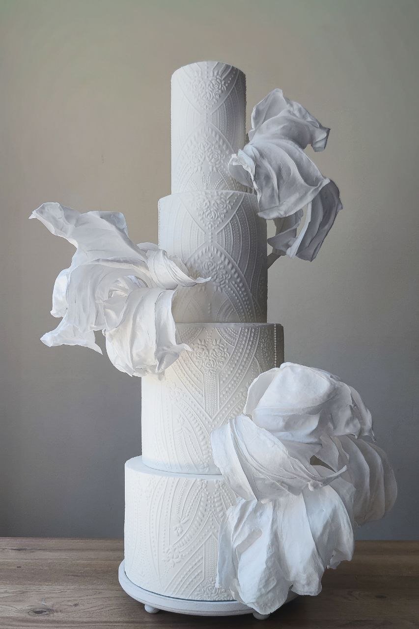 Modern luxury white wedding cake with contemporary textured design