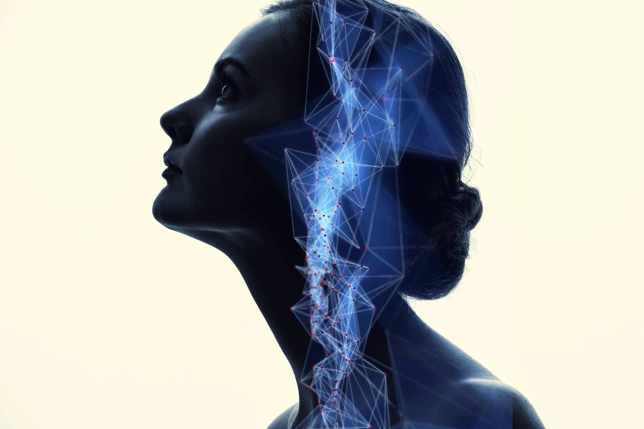 Silhouette of a woman looking upward, overlaid with a glowing blue geometric network pattern, symbolizing childhood trauma therapy.