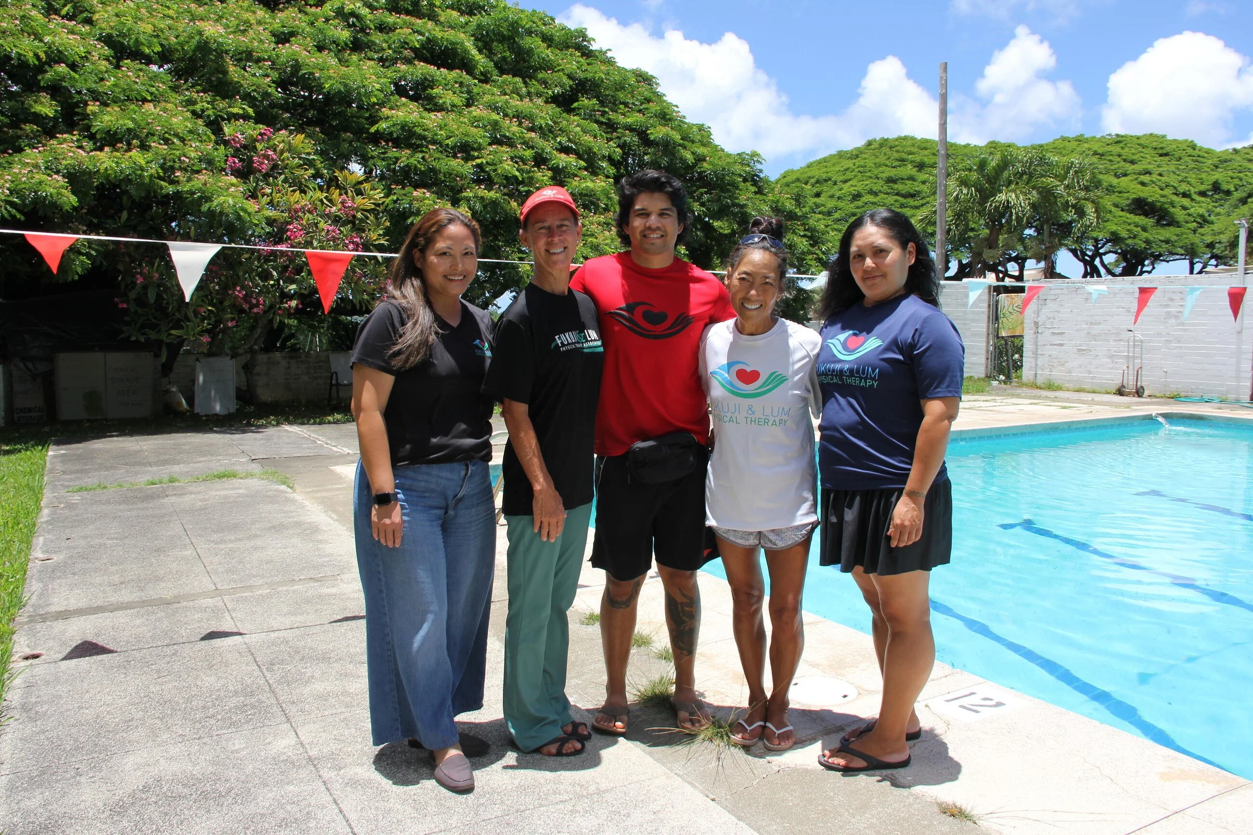 The Kaneohe Fukuji & Lum team gathered together at our outdoor heated pool.