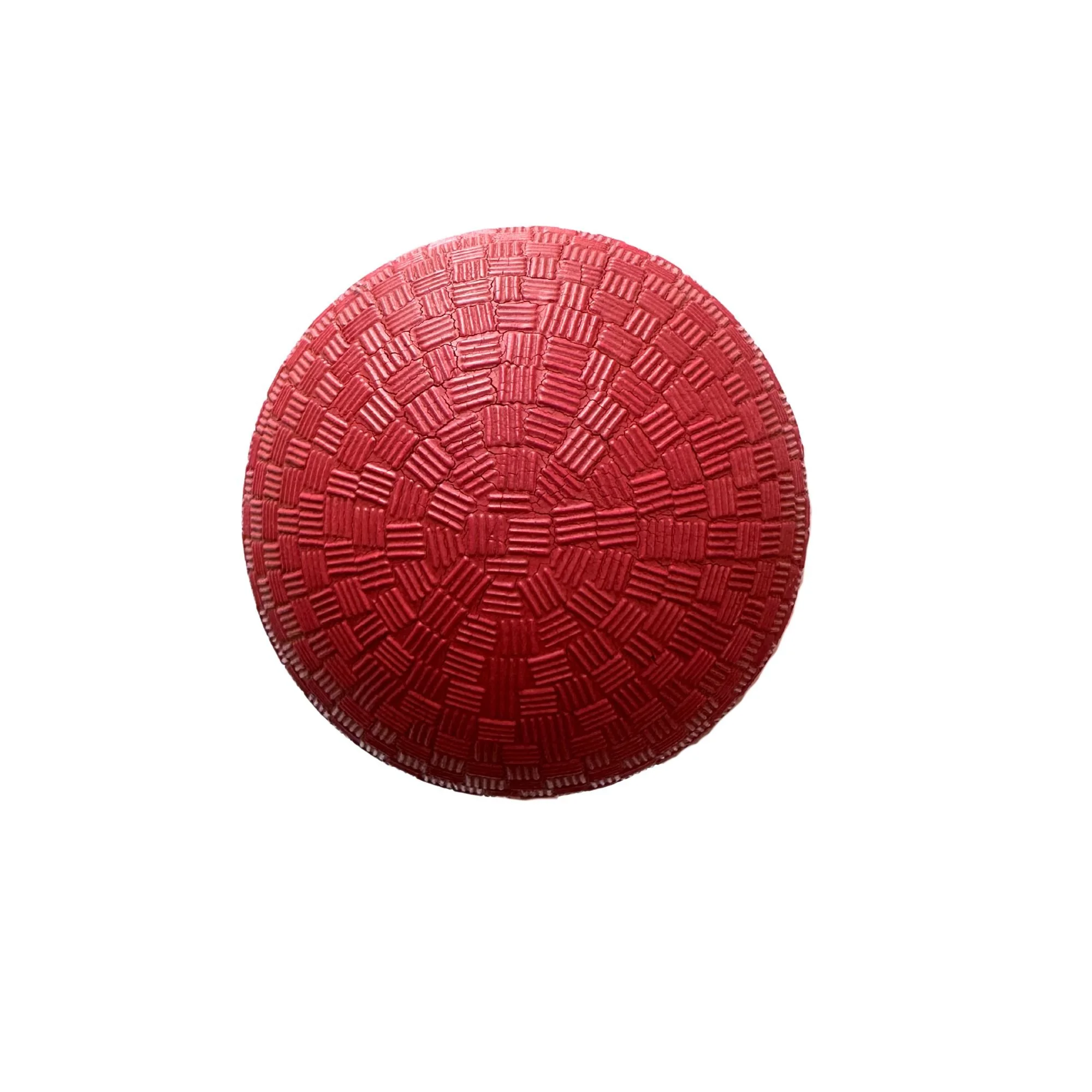 A red Champion Sports playground ball for exercise and mobility work.