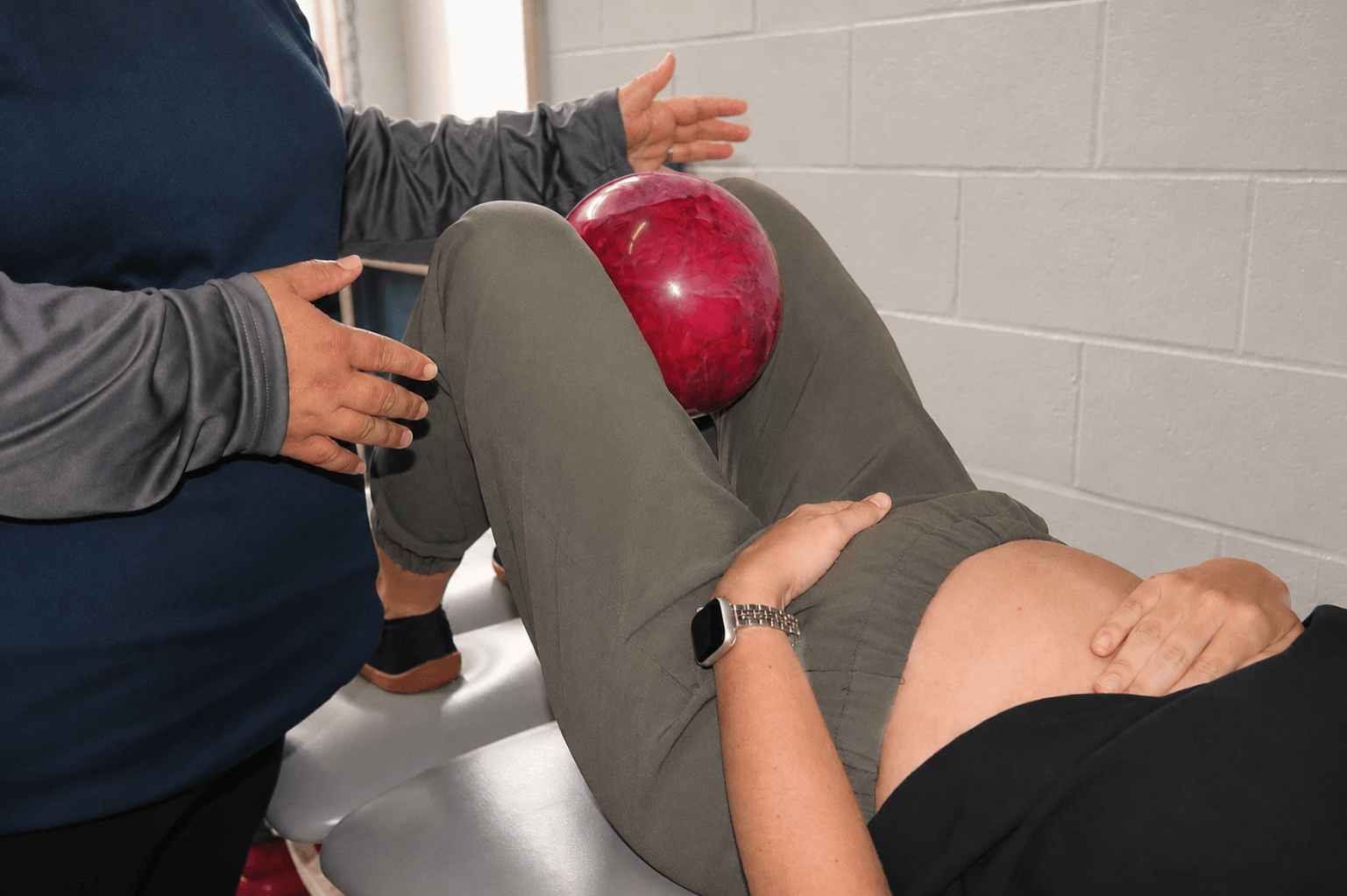 A physical therapist explains a personalized pelvic floor exercise program to a patient.