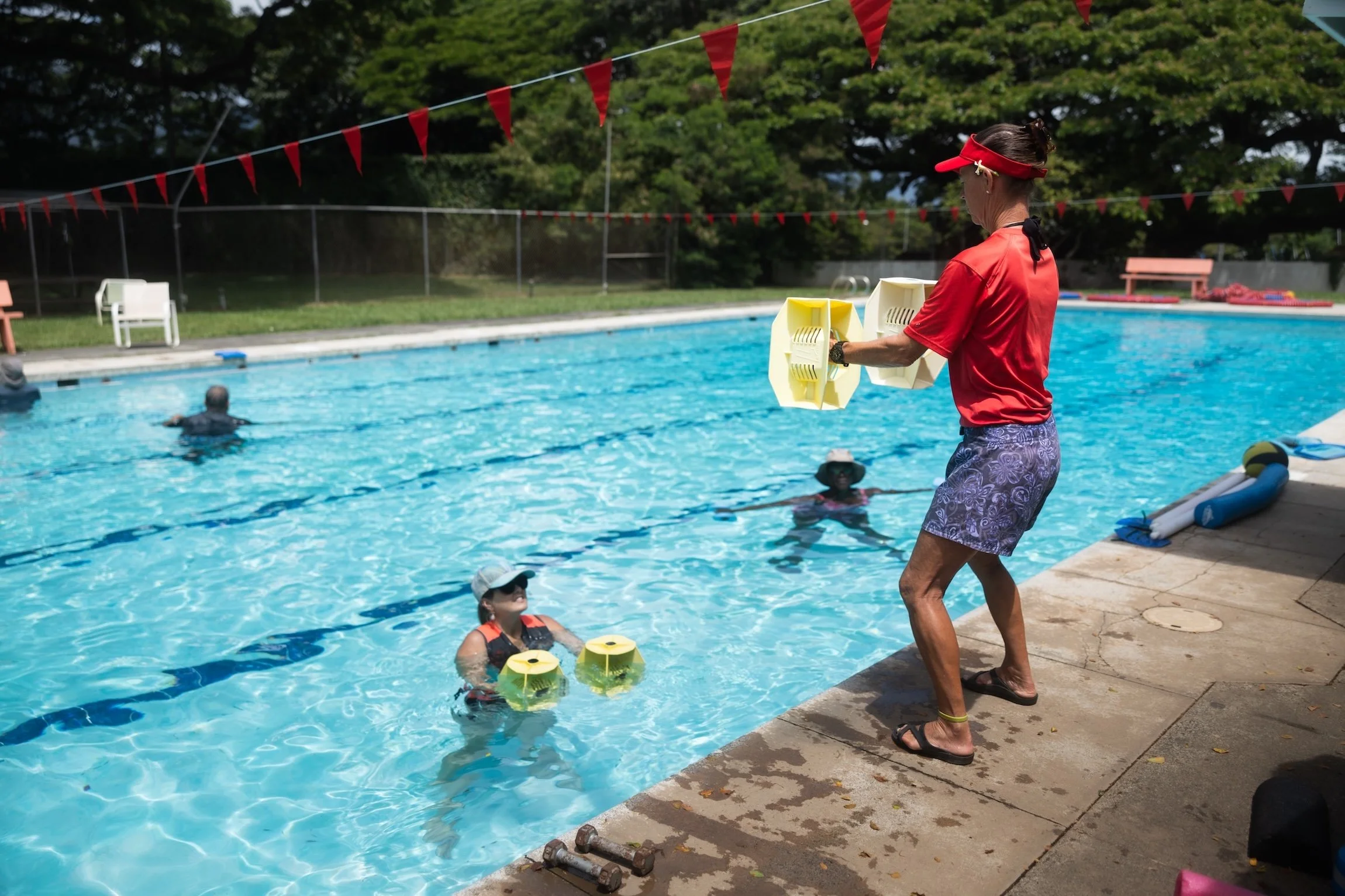 A Fukuji & Lum therapist leads patients through exercises in the heated therapy pool.