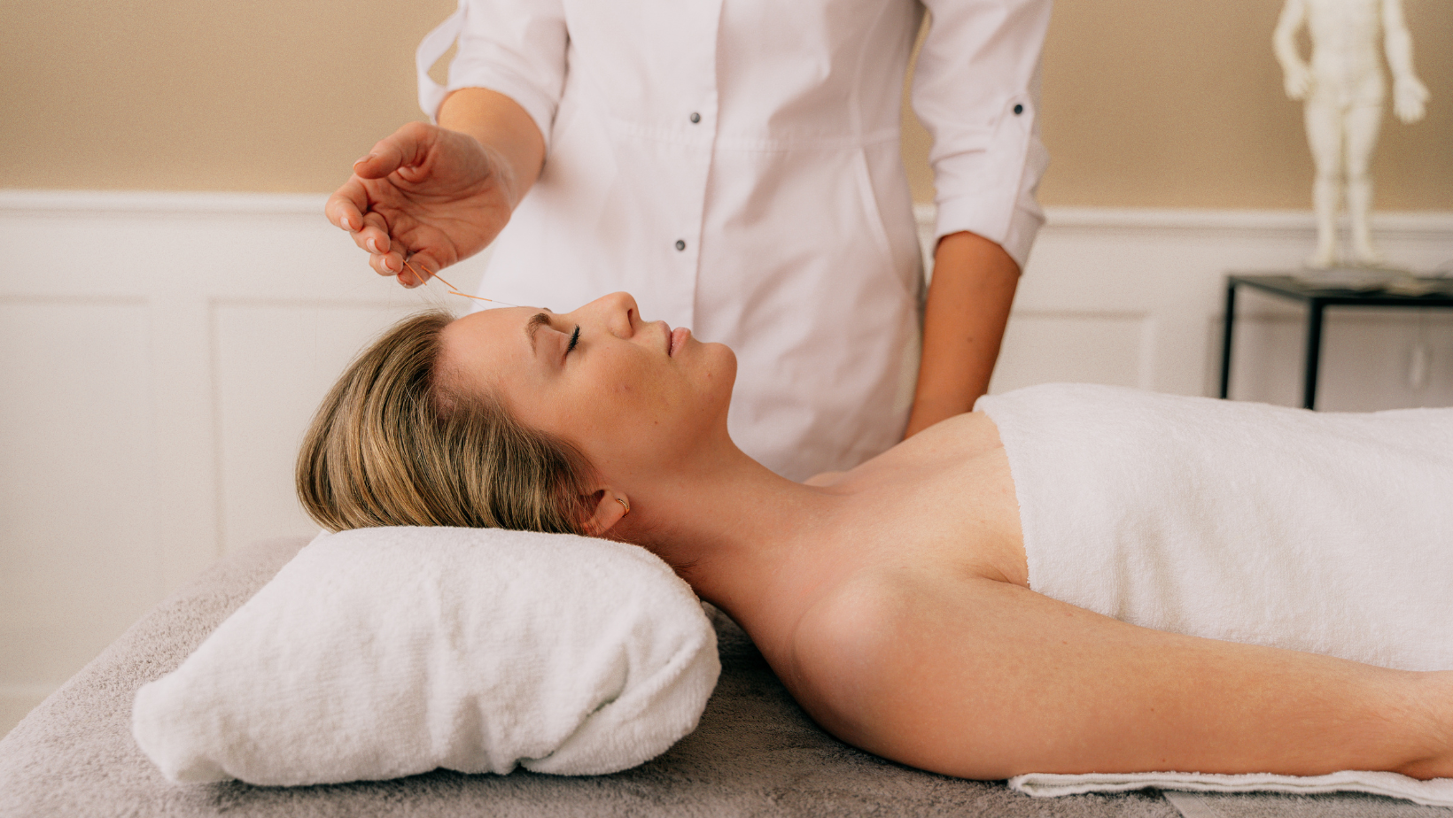 Patient resting comfortably on a treatment table during an acupuncture consultation at Celtic Roots Acupuncture