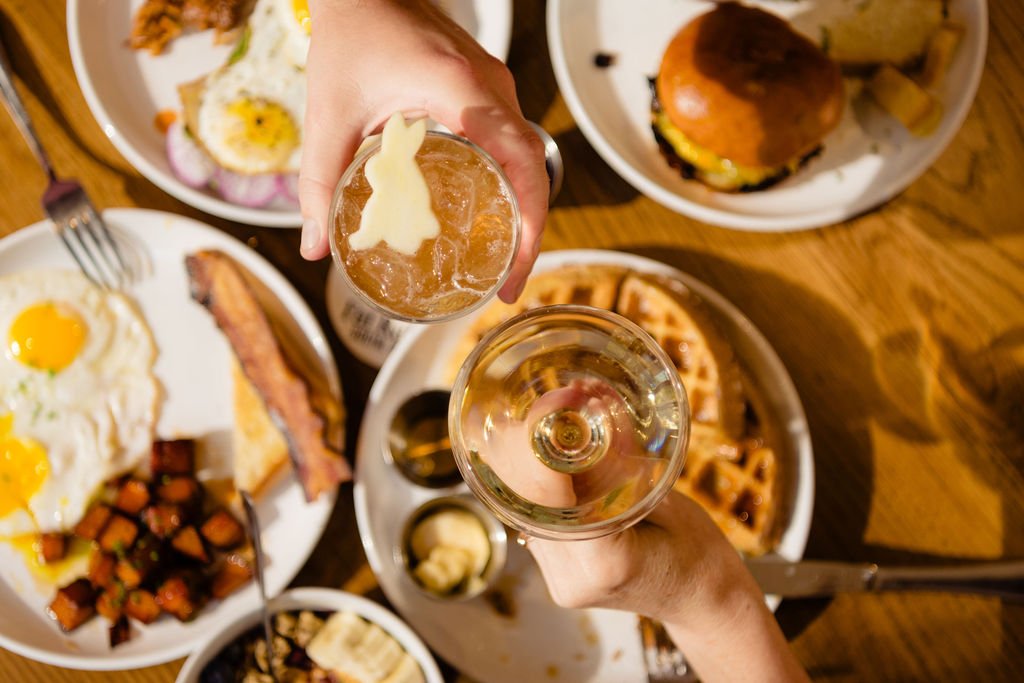Guests sharing a cheers at brunch in downtown Austin