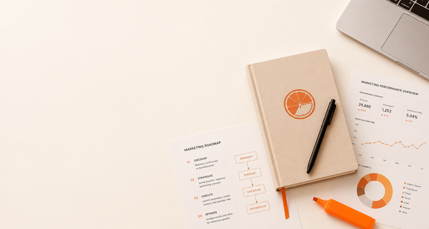 Workspace with marketing documents, a beige notebook with an orange logo, a marker, a highlighter, and a laptop.