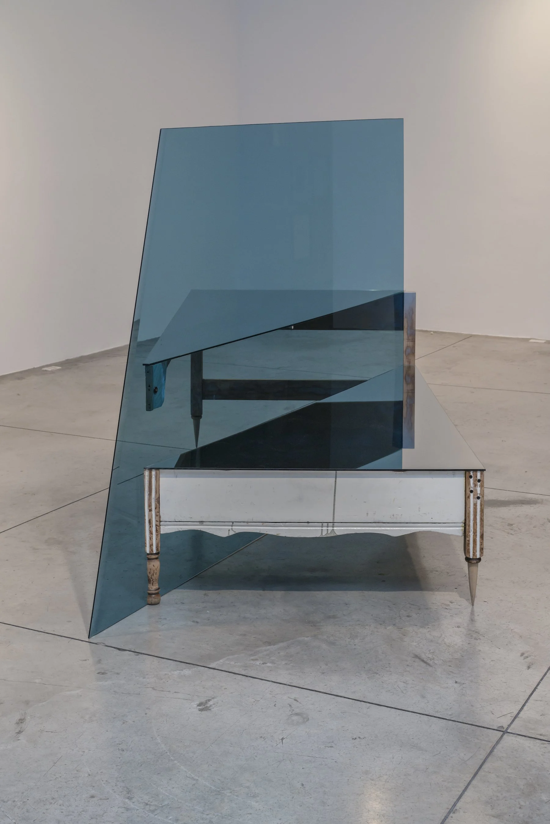 THE TIDES (after H. W. Longfellow), 2014 by artist Omar Barquet
210 x 110 x 140 cm / 82.5 x 43.5 x 55 in
Two manually altered and enamel painted beds, mirrors, blue tempered glass, paint brush fragments and carpenter nails.