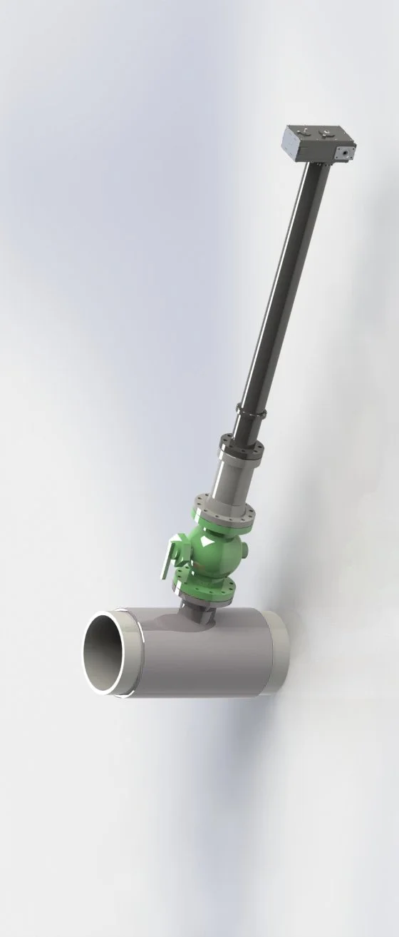 A metallic pipe fitting with a green valve and an angled pipe connected, exposed on a light gray wall.