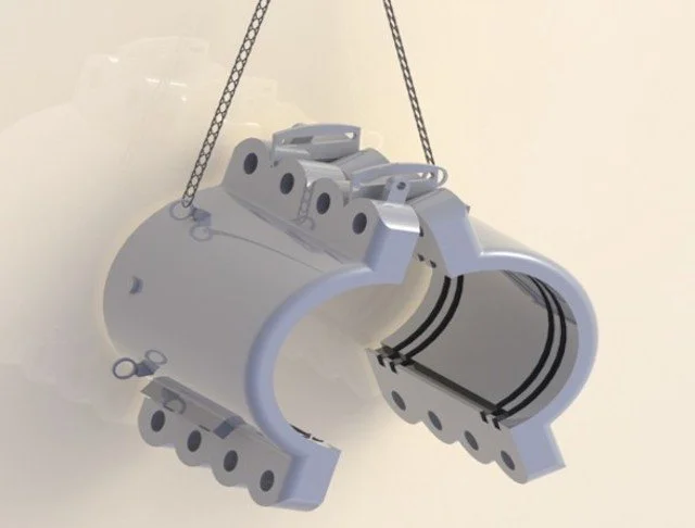 A silver metallic object with chains, resembling a mechanical mask or headset, possibly a part of machinery or equipment.