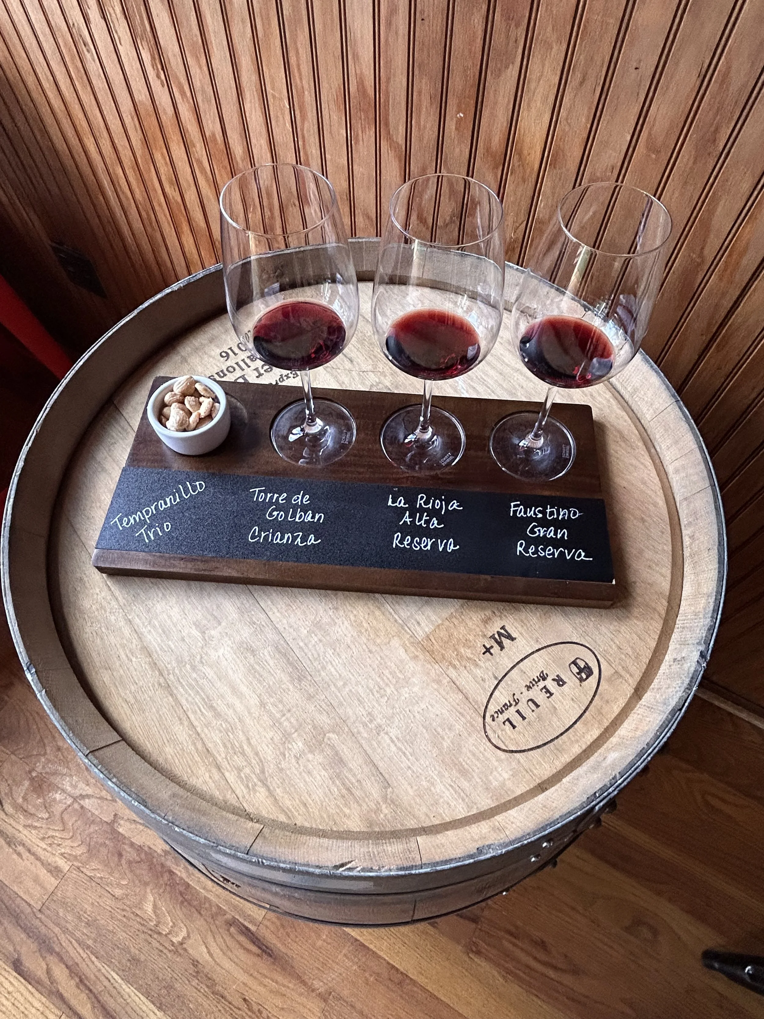Red wine flight at TINTO Wine Bar featuring curated tastings in Morrison, Colorado, near Red Rocks Amphitheatre.
