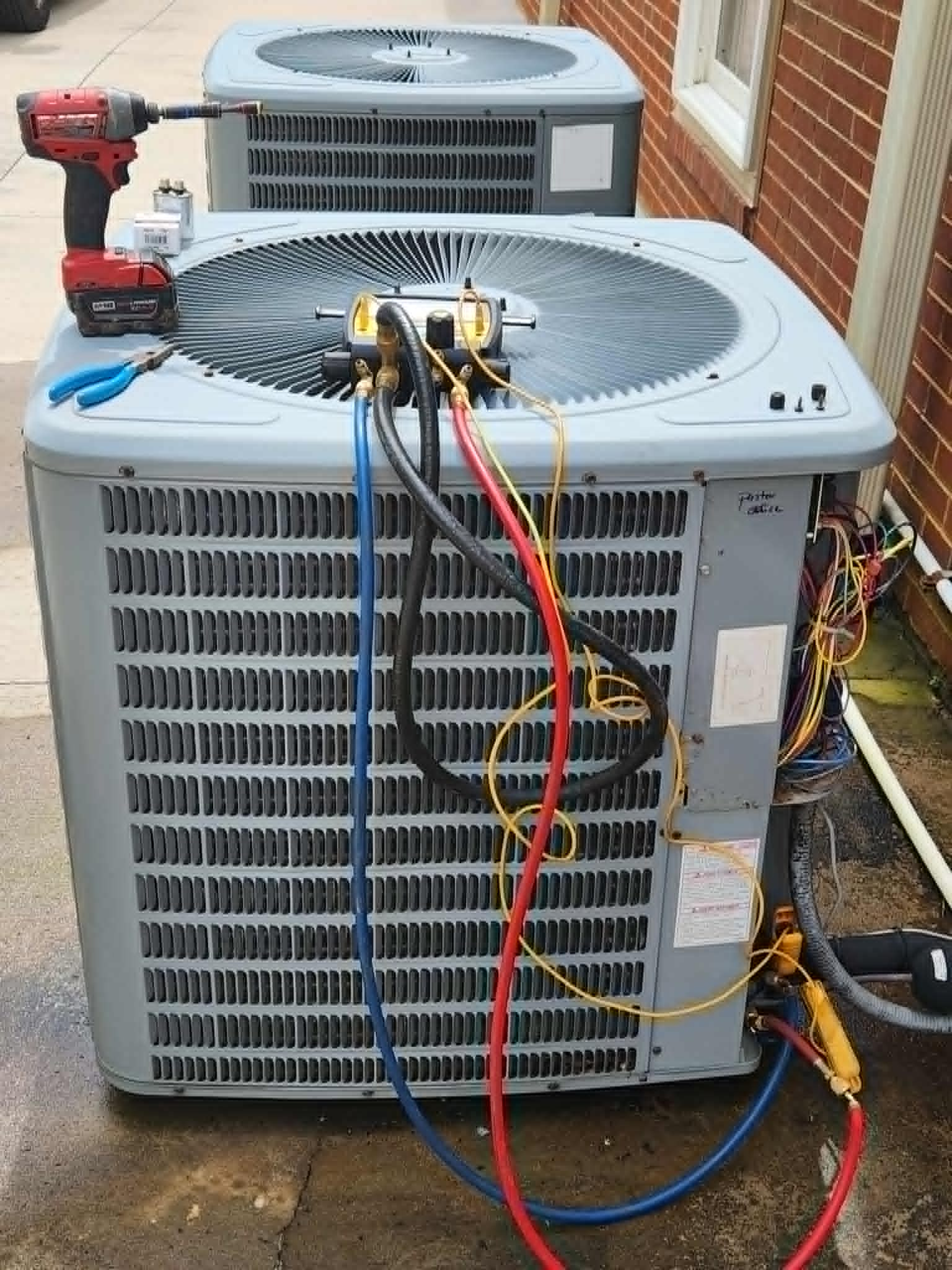 Air conditioning service in progress by Standard Heating & Air in Morganton, NC.