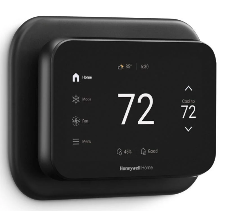 Smart thermostat displaying a temperature of 72 degrees Fahrenheit, with icons for home, weather, and mode settings on a black screen.