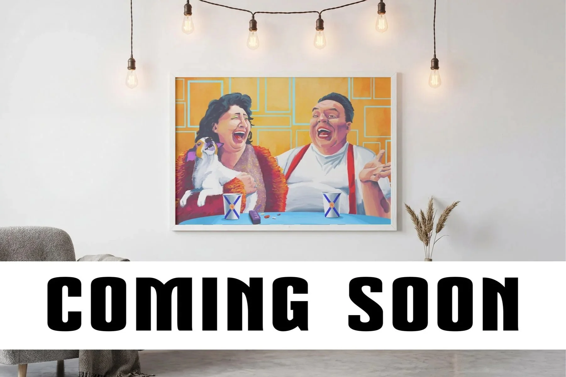 A colorful painting of two laughing people and a dog sitting on their laps, with snacks and drinks on a table in front of them. The background is yellow with geometric lines. The scene is displayed on a white wall with hanging light bulbs.