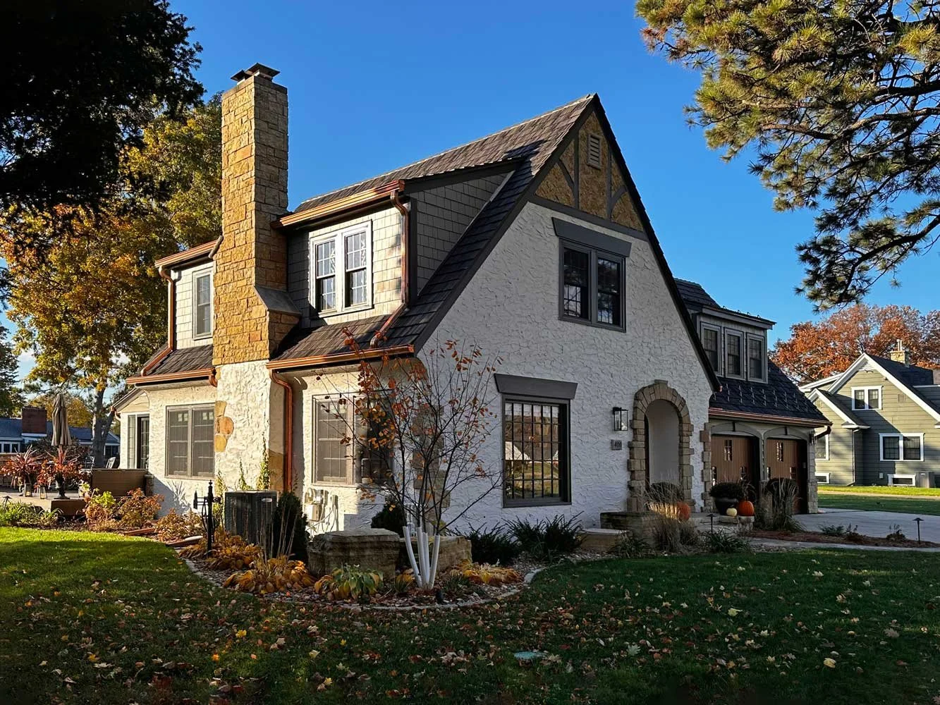 Stucco home with copper Leaf Sentry gutter covers