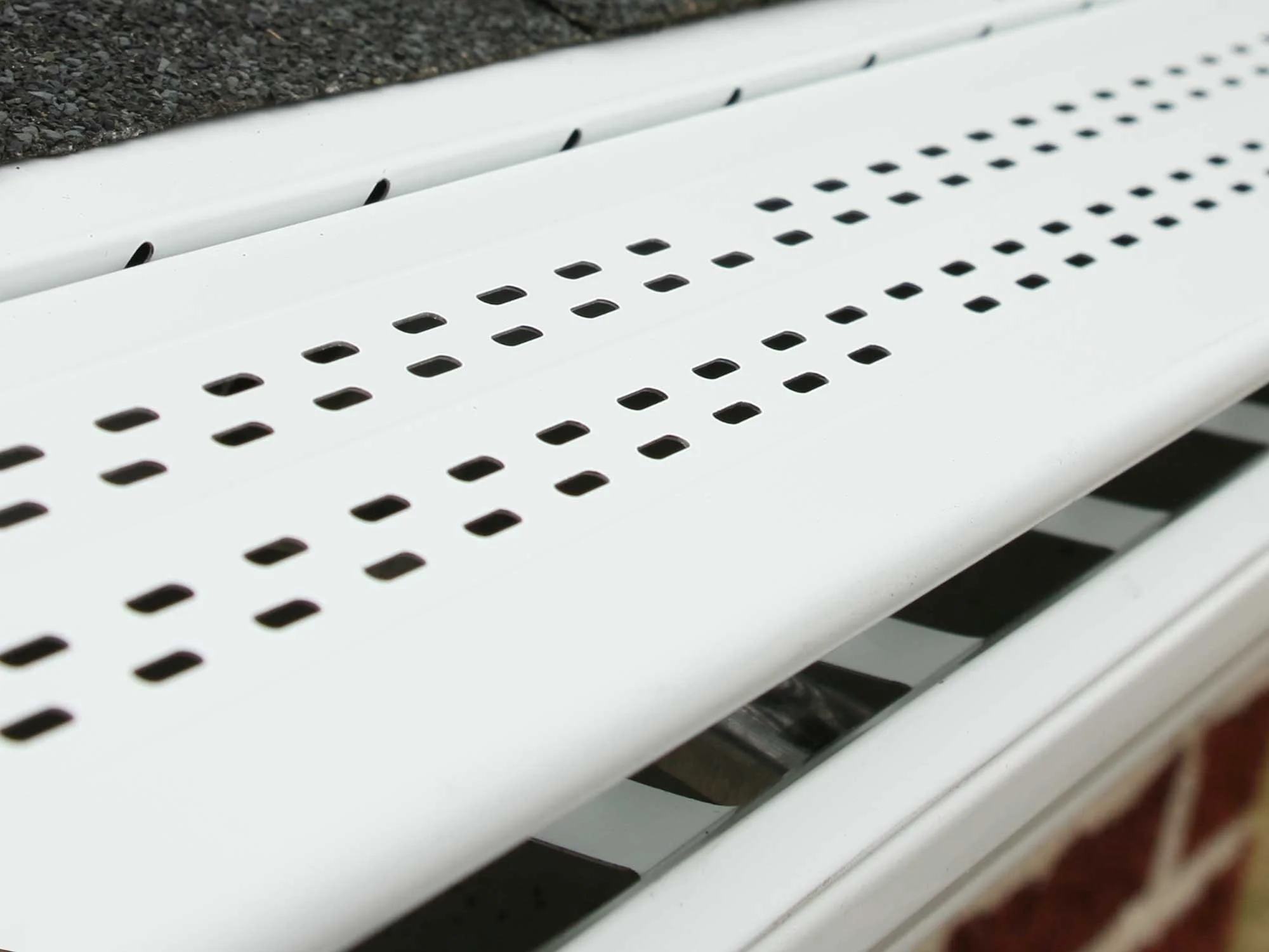 Leaf Sentry High-Flow Panel on a brick house