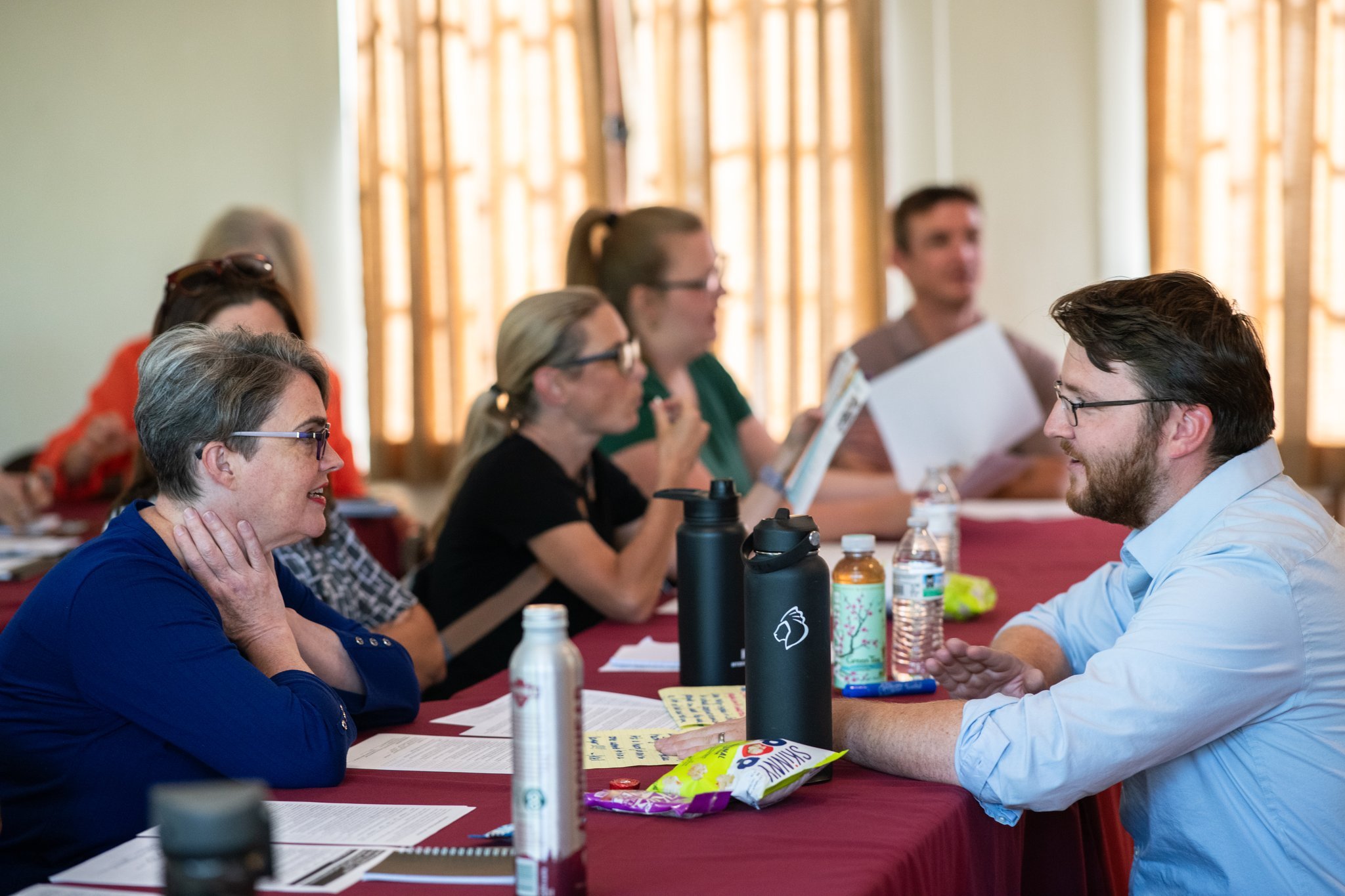 Jesse Redmond helps facilitate a board accelerator class at Redlands Community Center