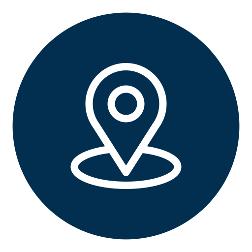 Icon of a location pin inside a dark blue circle.