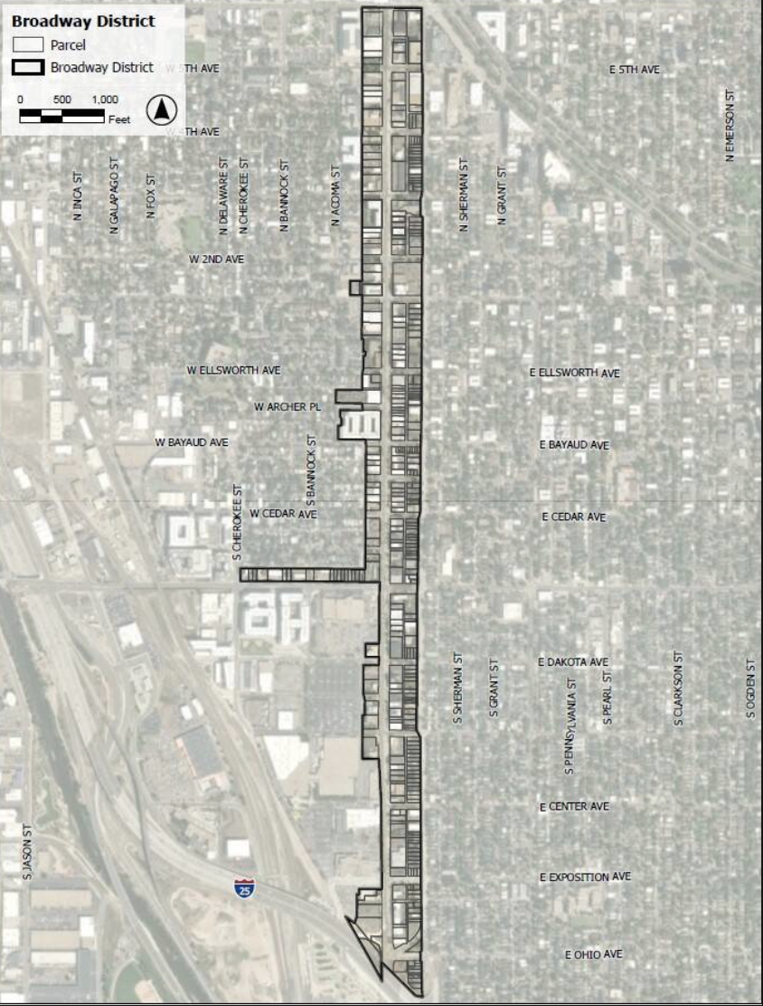 Map of the Broadway District showing parcels outlined in black and the broader district boundary outlined in white, with street names and a scale bar.