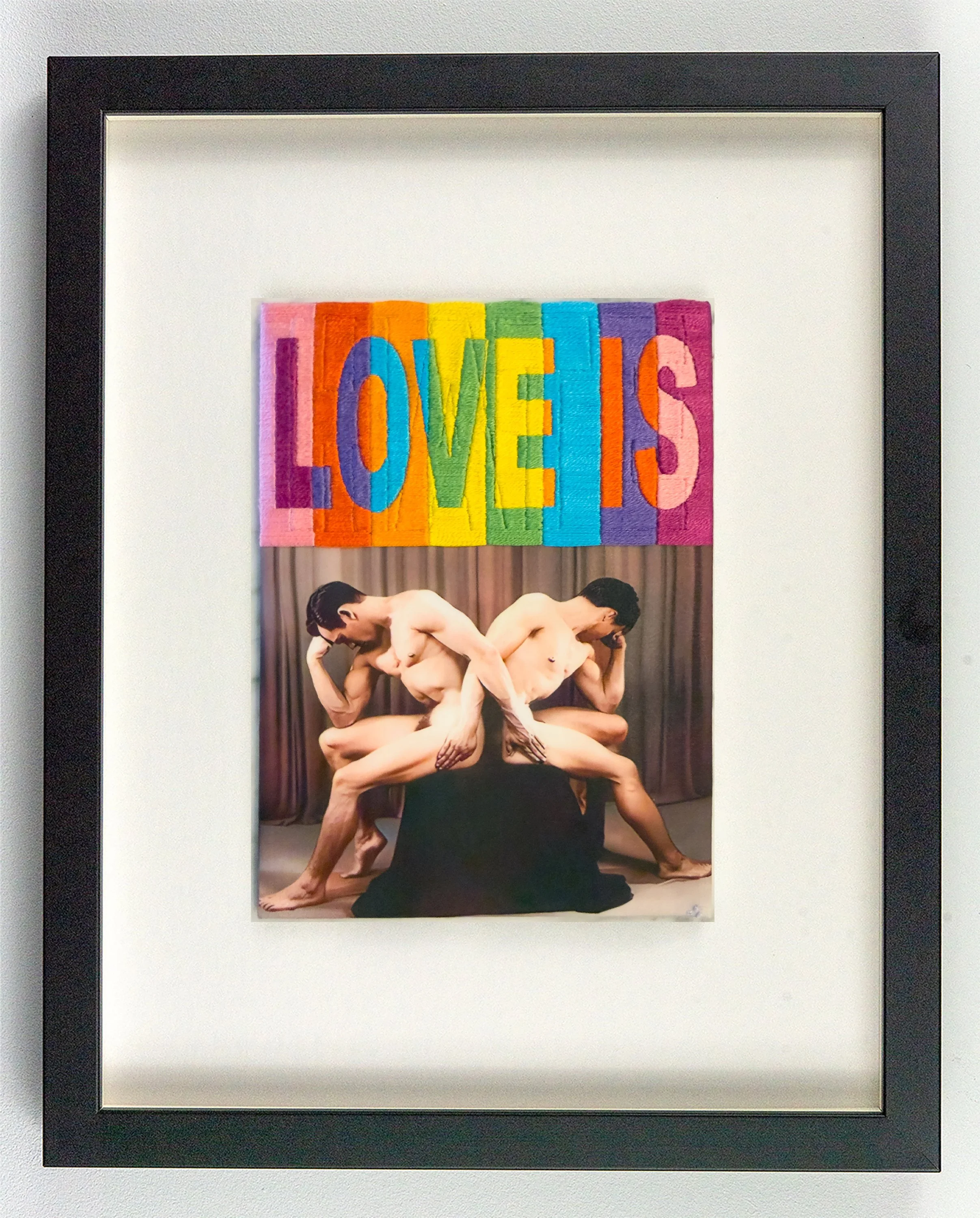 Rainbow pride colours overlay two men who cannot meet each other's eyes. HATE persists beneath the slogans. Hand-embroidered queer art by Paul Gravett.