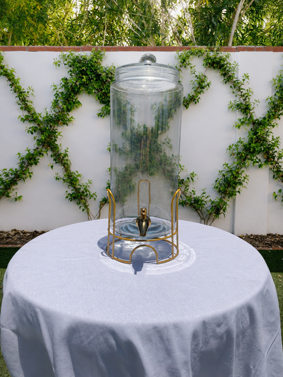 Glass & gold drink dispenser