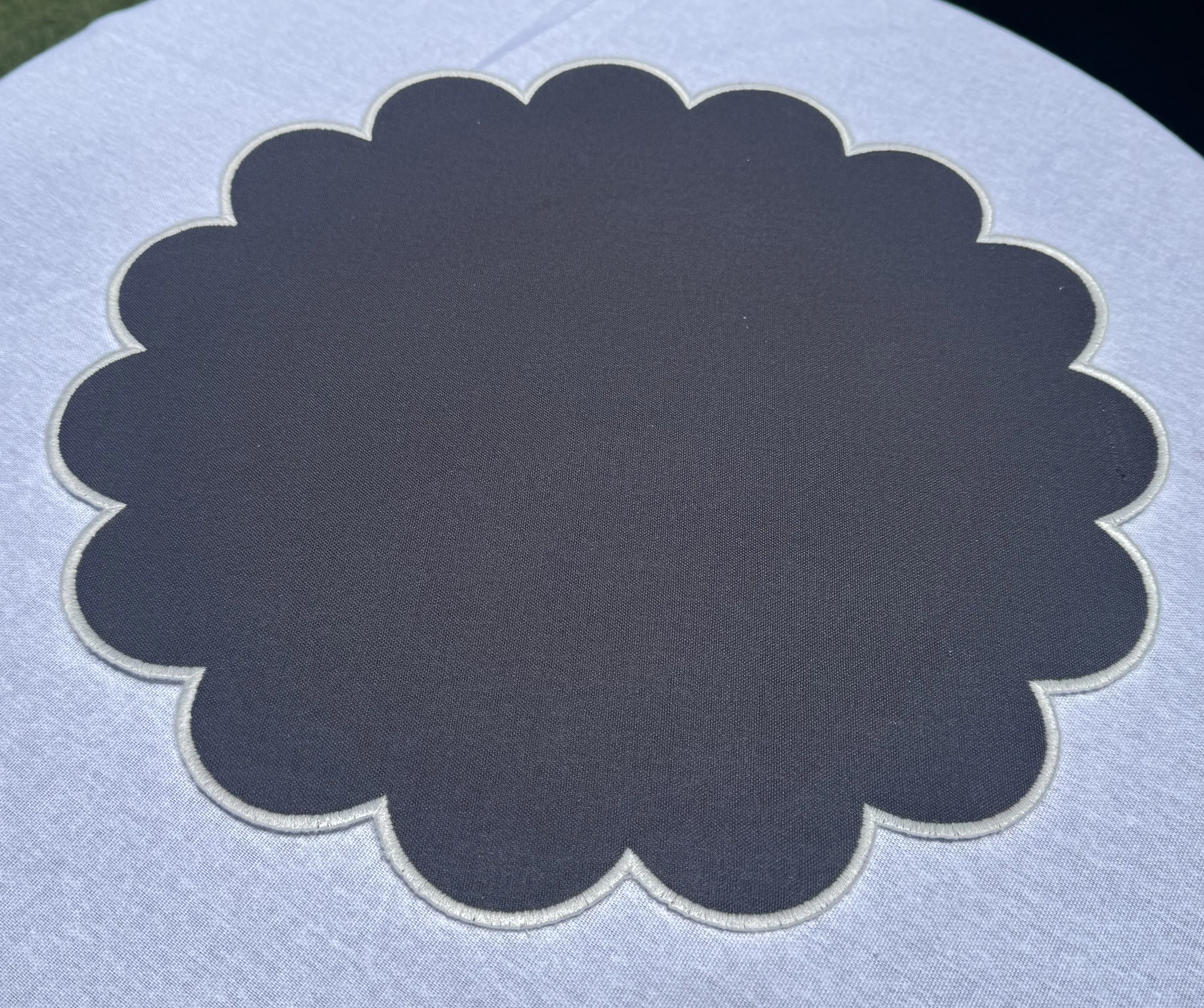White & black scalloped placemat