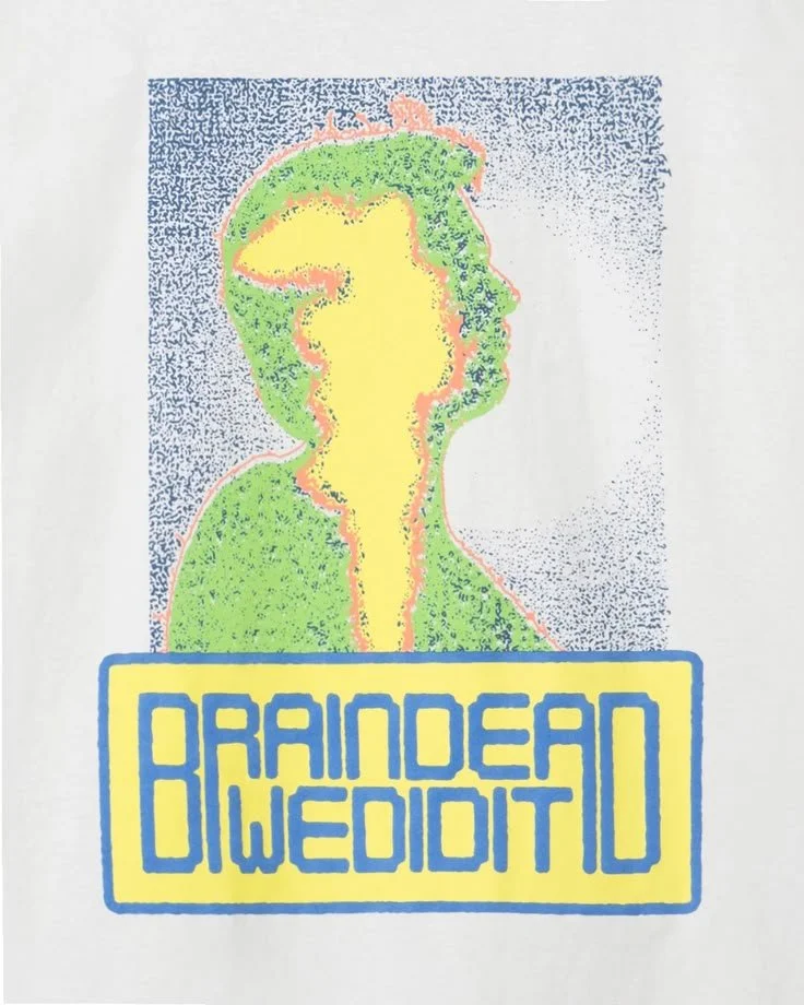A stylized, colorful drawing resembling a person with a green outline and yellow face, with text below that reads 'Raindean Wediidtd' in a yellow and blue box.