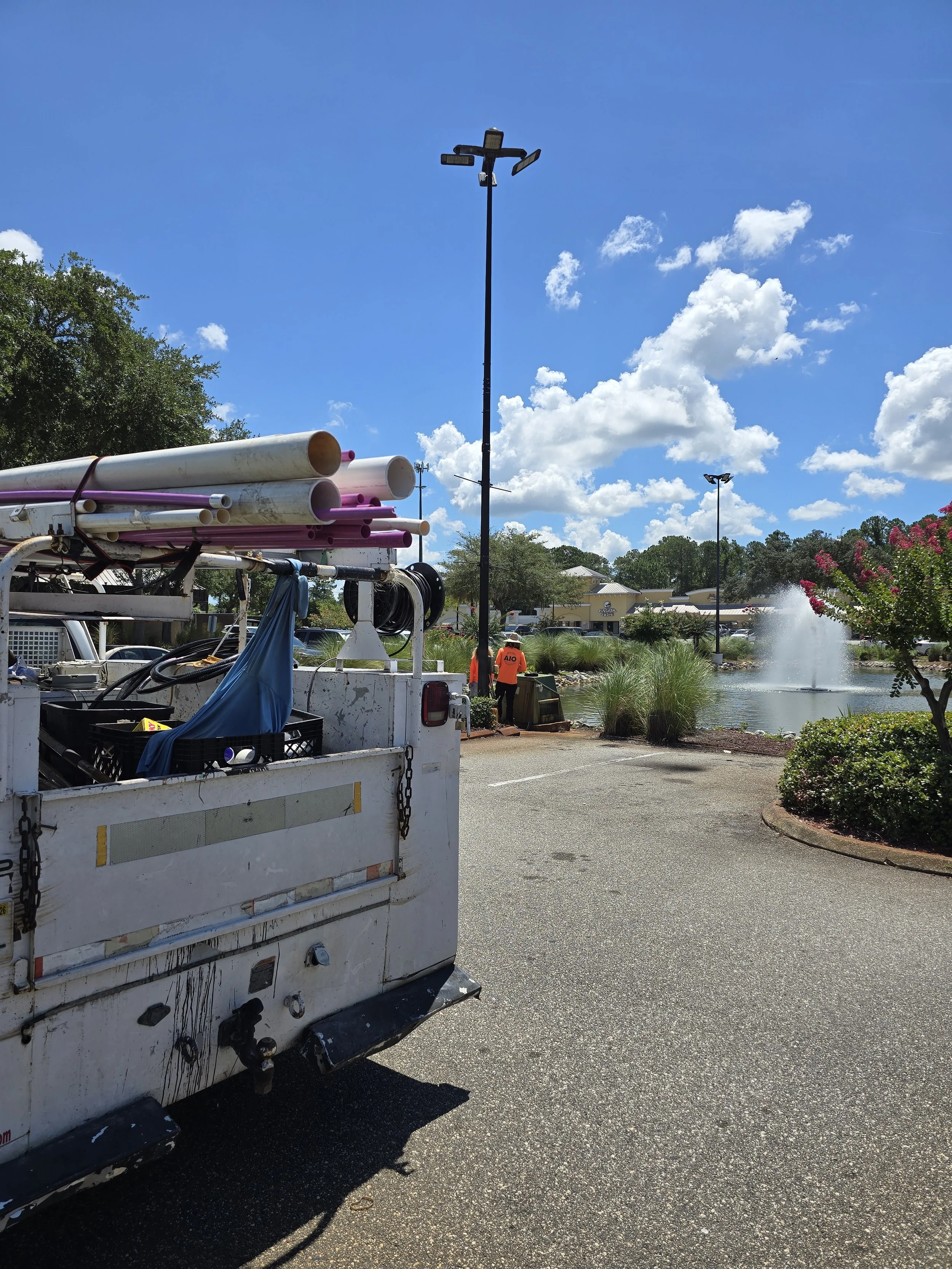 AIO Property Maintenance equipment on a job site in Jacksonville, FL