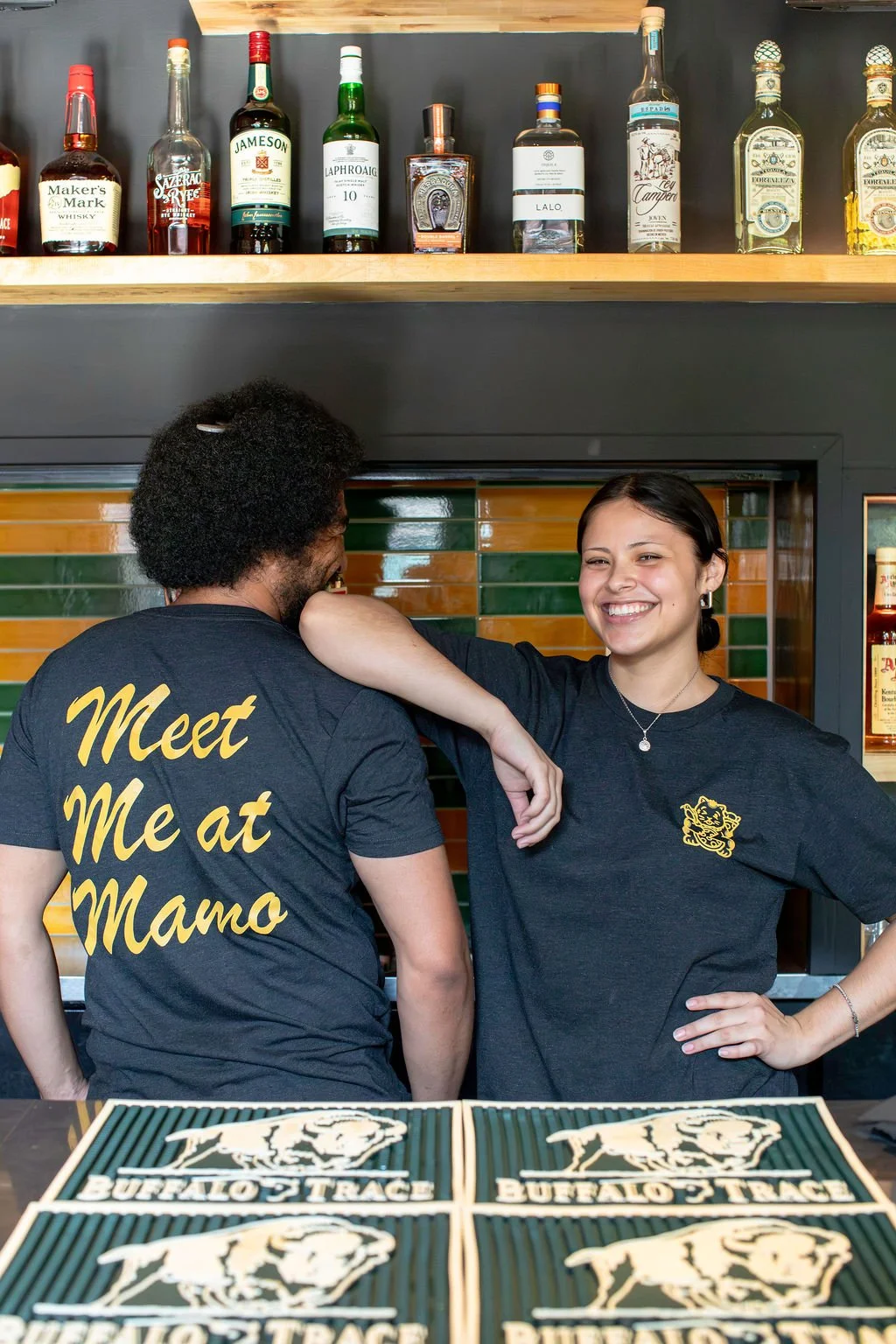 Team photo image: Pizza Mamo team members standing together in Chinatown Honolulu