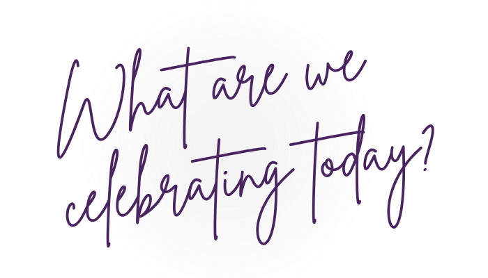 A white circular plate or sign with purple handwritten text that reads, "What are we celebrating today".