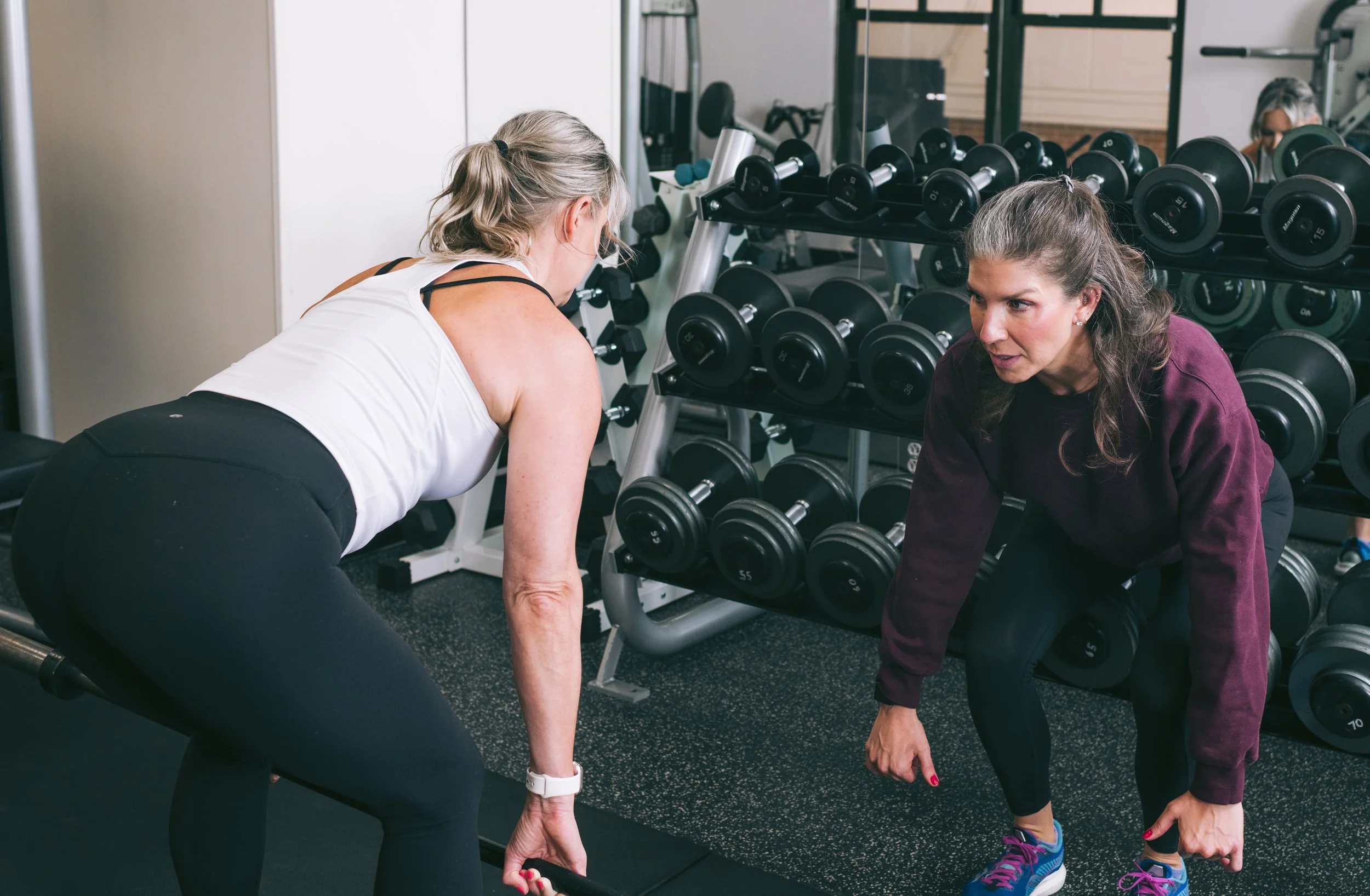 Physical therapist guiding a patient through corrective exercises to improve strength and movement.