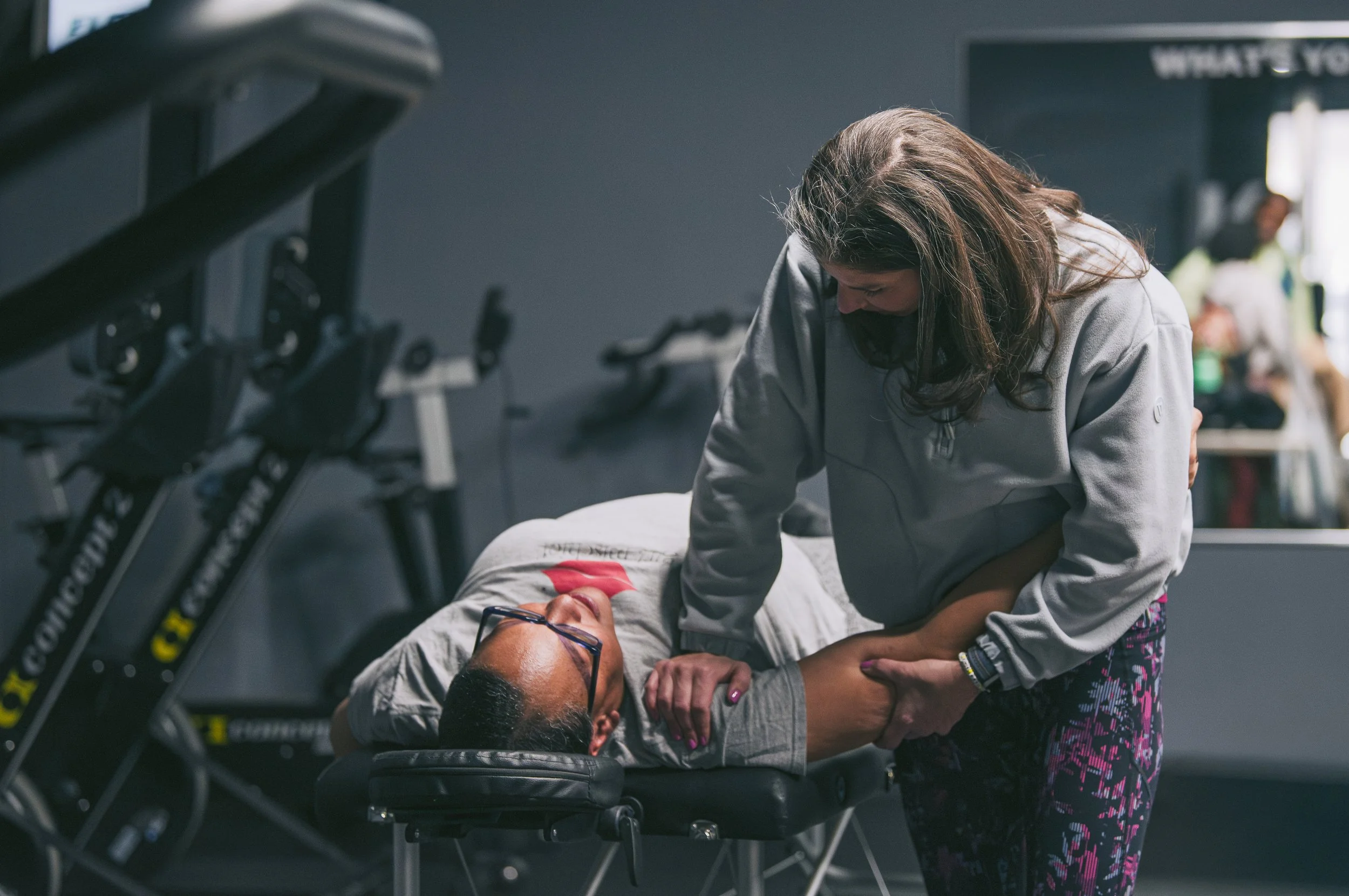 Physical therapist providing hands-on manual therapy to improve a patient’s shoulder mobility.