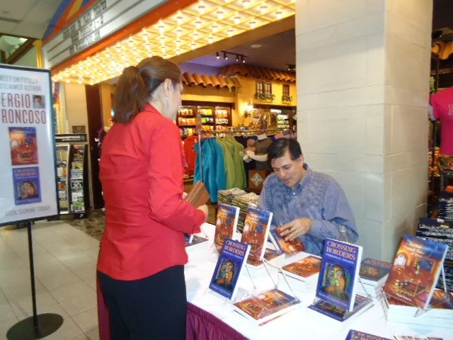 Sergio Troncoso signing books at El Paso International Airport, 2011.