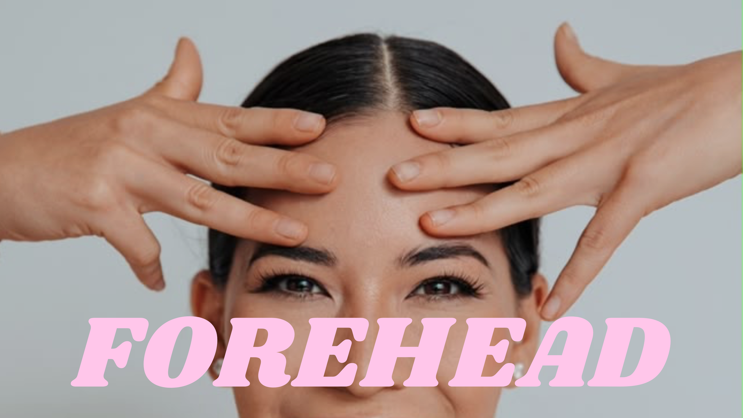 A person with dark hair is holding their head with both hands, with fingers spread across their forehead and temples. The person's eyes are visible, and they have dark, arched eyebrows and smooth skin. The background is a neutral, light gray color. Overlaid on the image is the word "FOREHEAD" in large, pink, and bold letters.