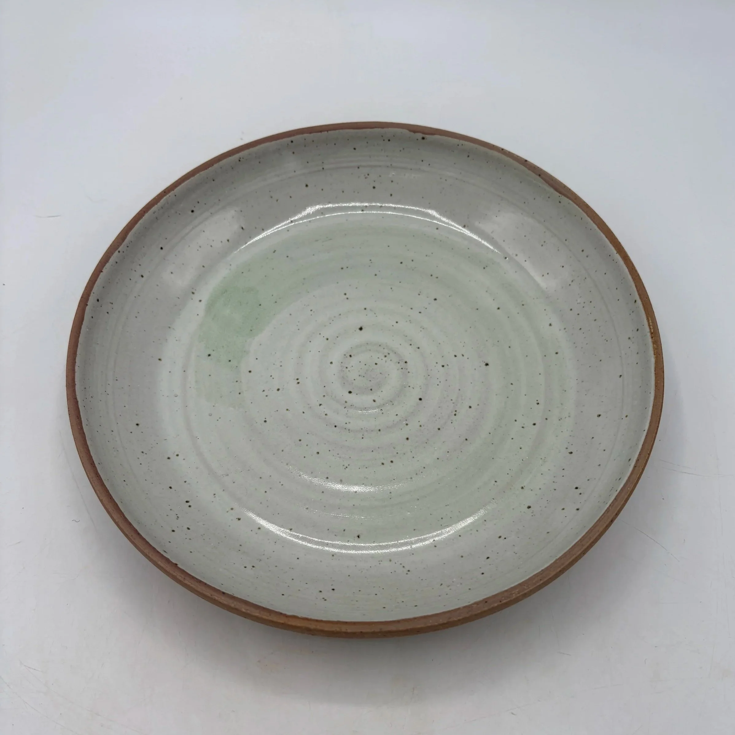 Wheel thrown plate, fired to cone 06 reduction