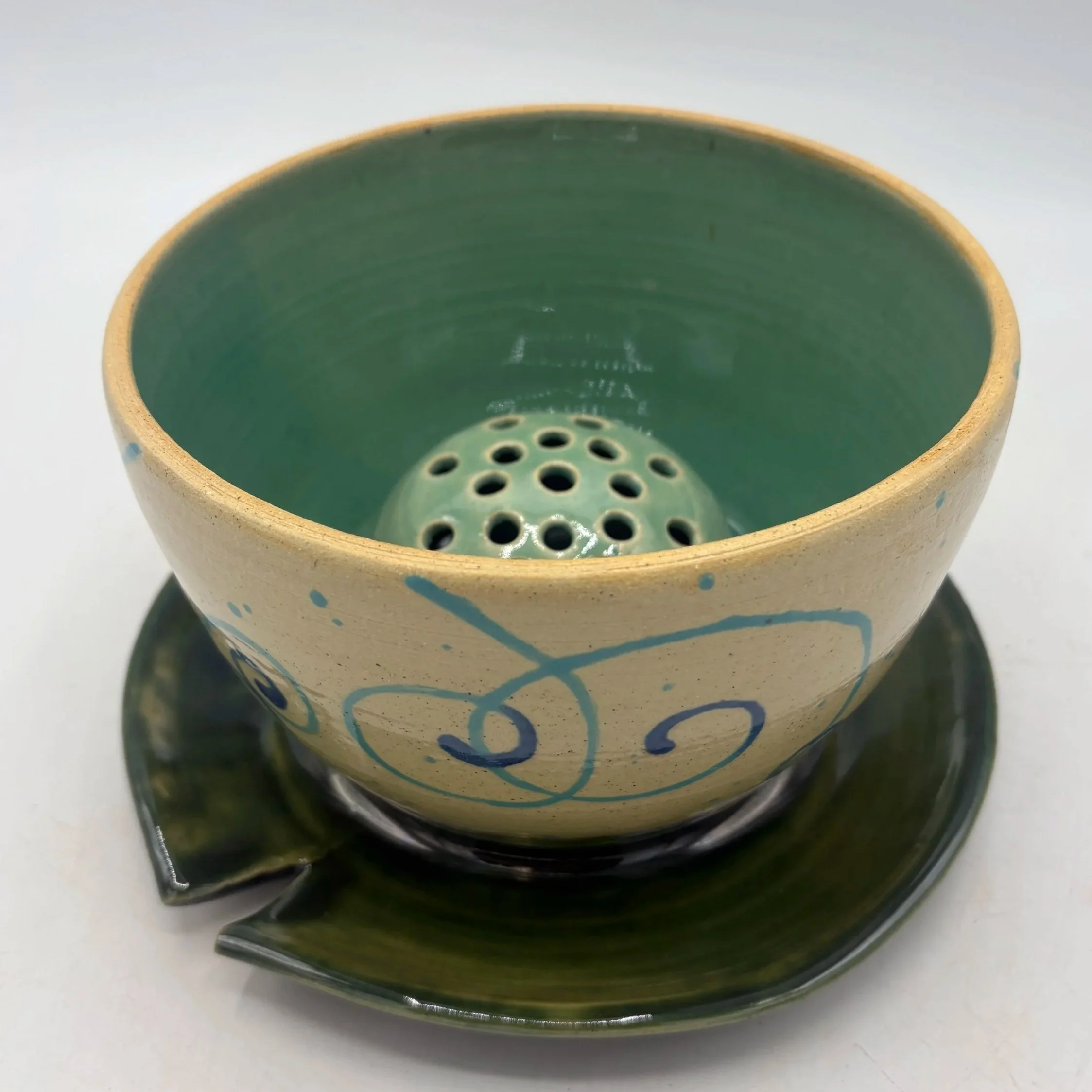 Wheel thrown and altered vase, painted with underglaze, fired to cone 06 oxidation