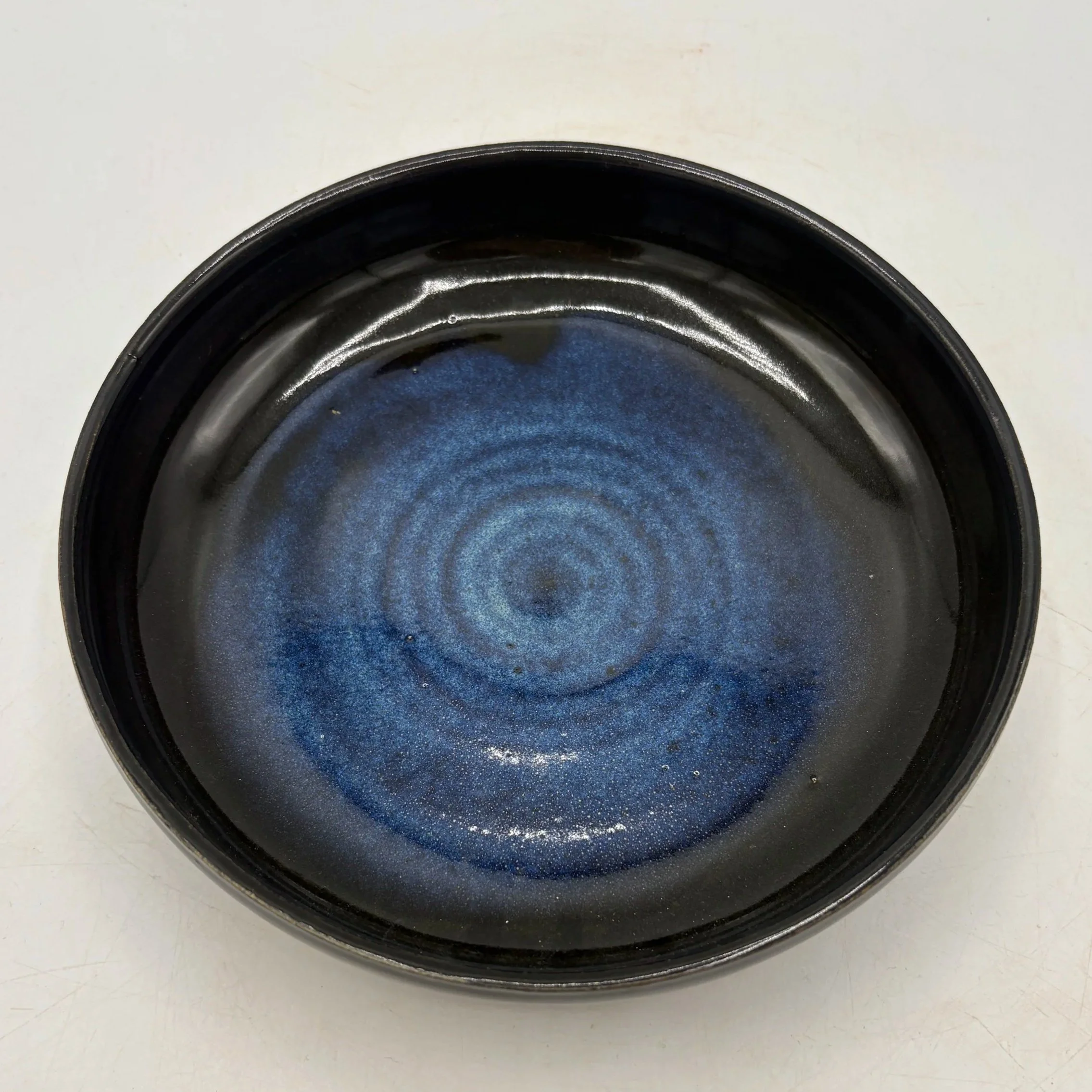 Wheel thrown plate, fired to cone 06 oxidation