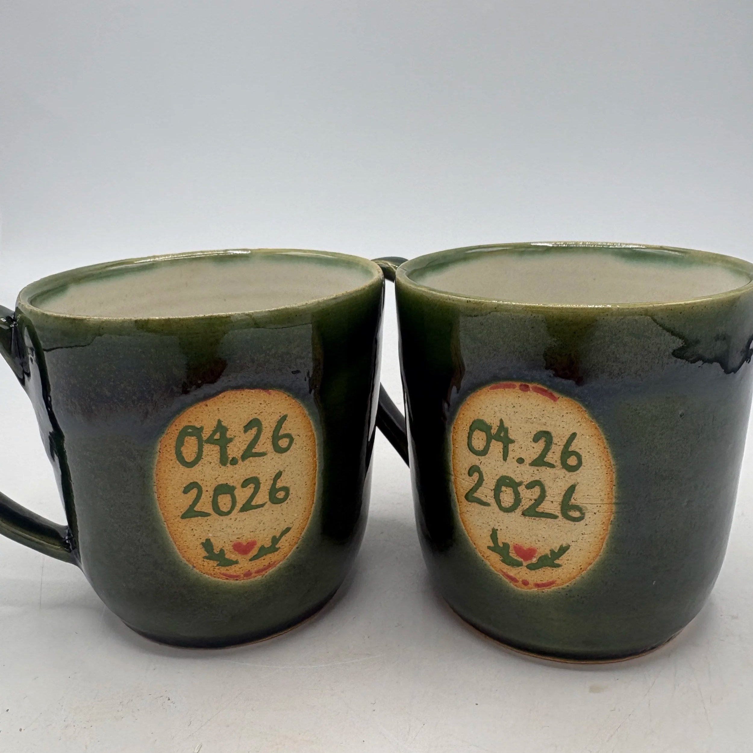 Wheel thrown and underglaze painted mugs, fired to cone 06 oxidation