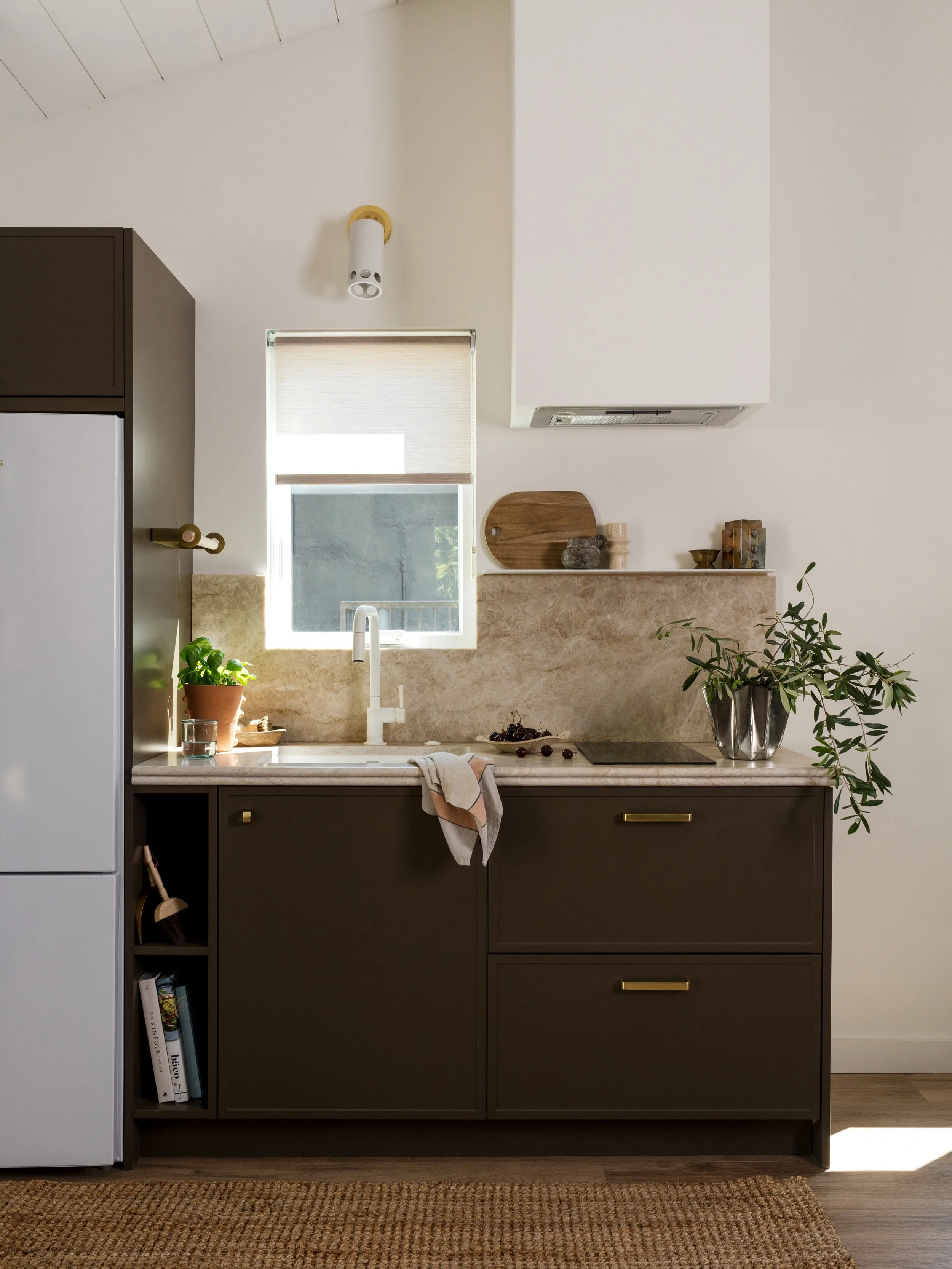 Little kitchen, big details! I wanted the little kitchenette in Project #StayInCasita to hold its own in the open space. With an earthy greenish brown for the cabinets, a double bullnose countertop profile, and some fun lighting and hardware, it chec