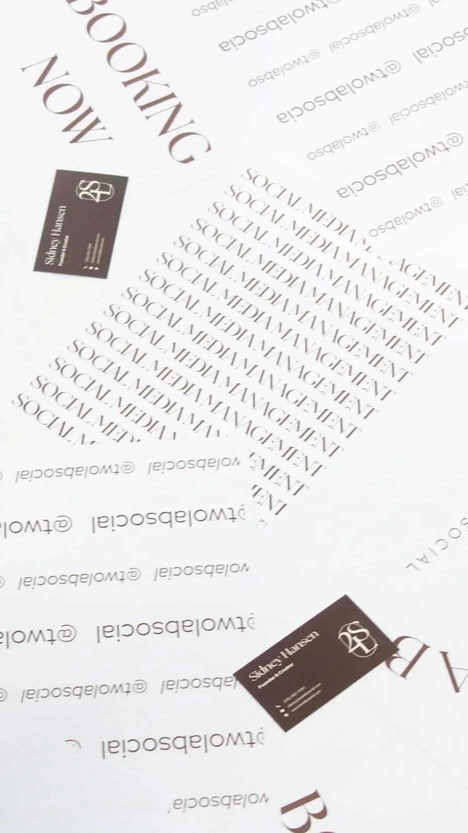 Multiple sheets of paper with repeated text 'SOCIAL MEDIA MANAGEMENT' and a business card with the name 'Sidney Hansen' and contact information.
