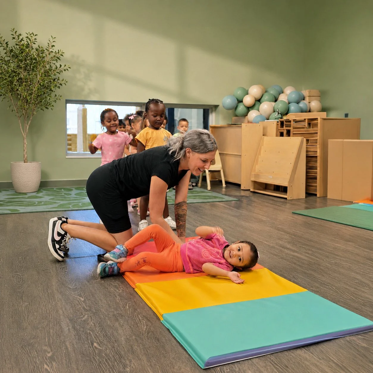 TOL-gymnastics-teacher-roll-over-girl.jpg