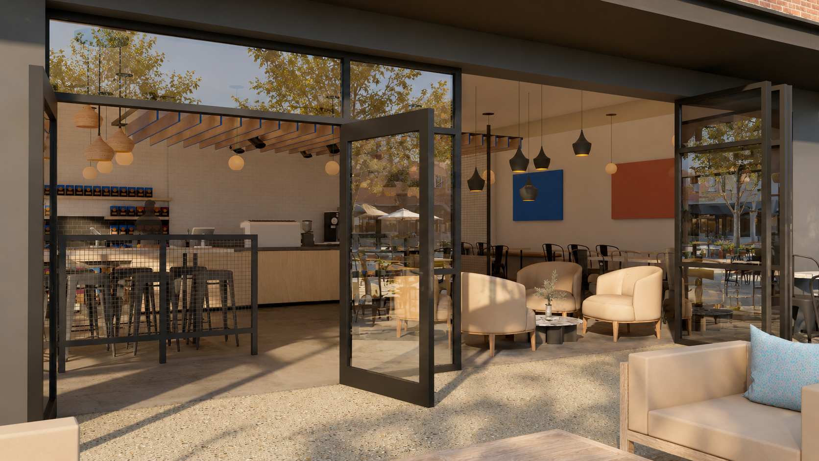 A cozy modern cafe interior with beige armchairs, black pendant lights, and a barista counter, seen through open glass doors during daytime.