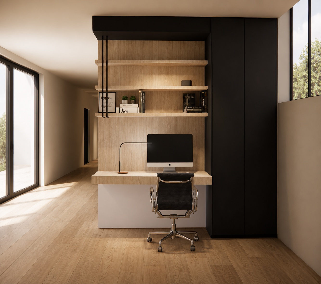 Modern home office with black and wood desk, computer, black swivel chair, wooden shelves with books and decor, large windows, light wood flooring.