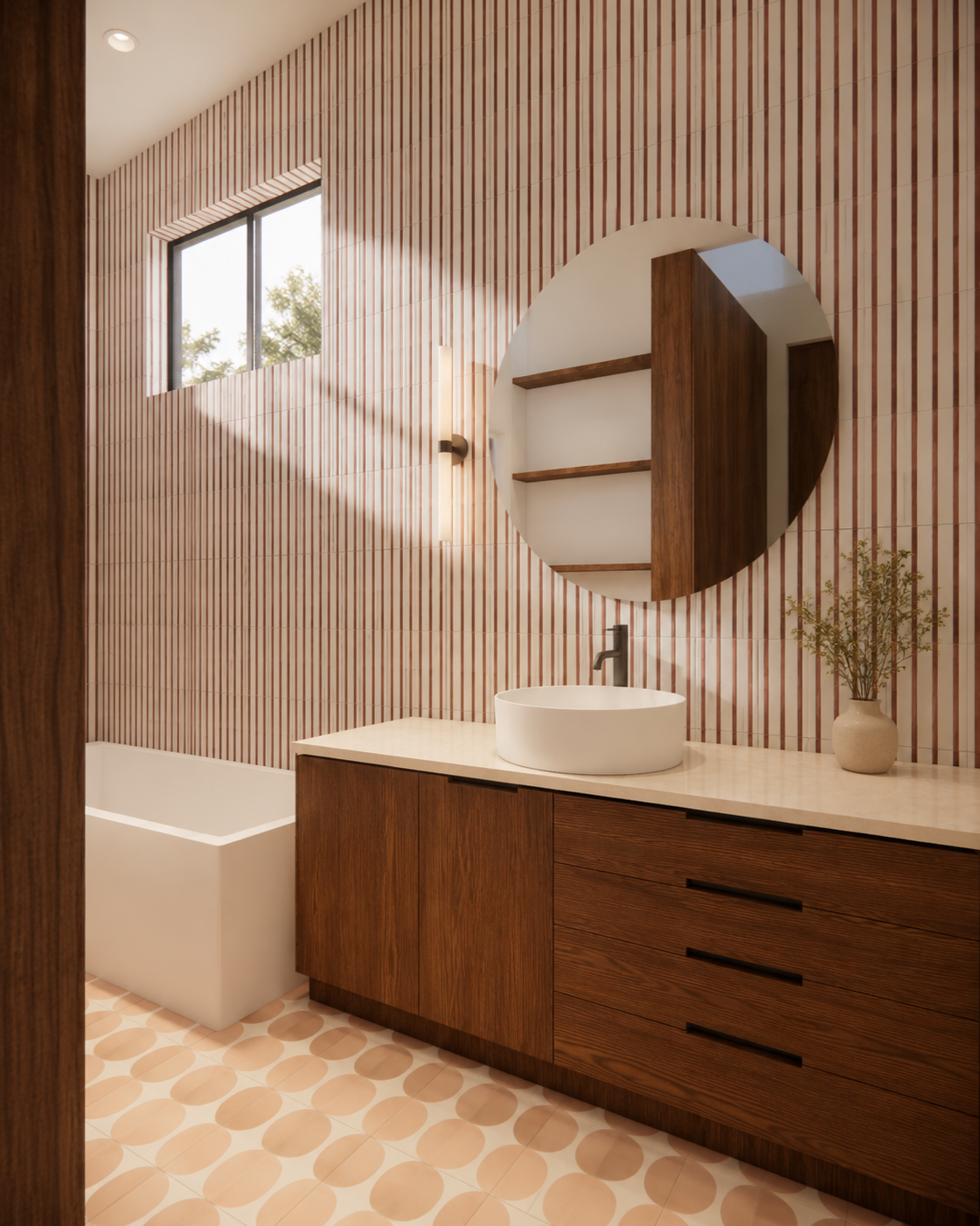 Modern bathroom with wood vanity, white vessel sink, round mirror, patterned pink and white tiled wall, small window, and decorative plant in a beige vase.